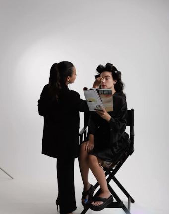 A black and white photo sequence shows a photoshoot session in progress against a white backdrop.