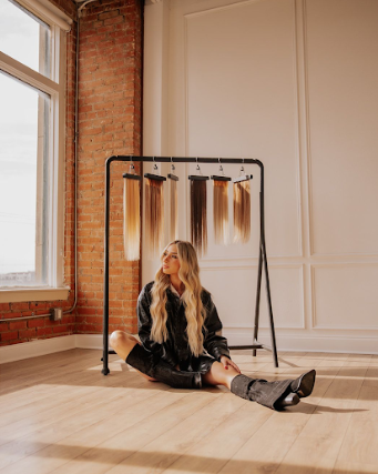 A series of artistic photos showing a figure in black against a brick wall and wooden floor interior.