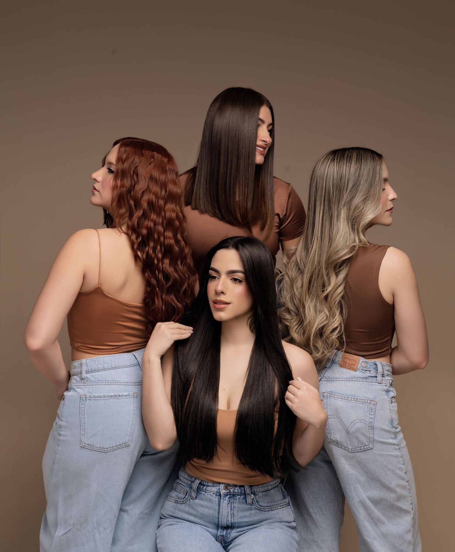 Three women in matching jeans pose together showing different angles and poses in a studio setting.