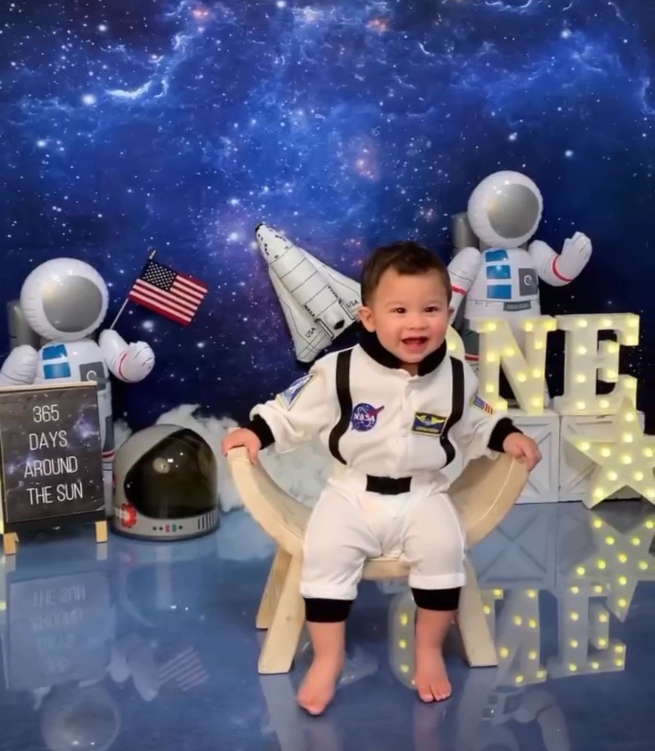 Space-themed baby photo series showing a small child in astronaut outfits against starry backgrounds.