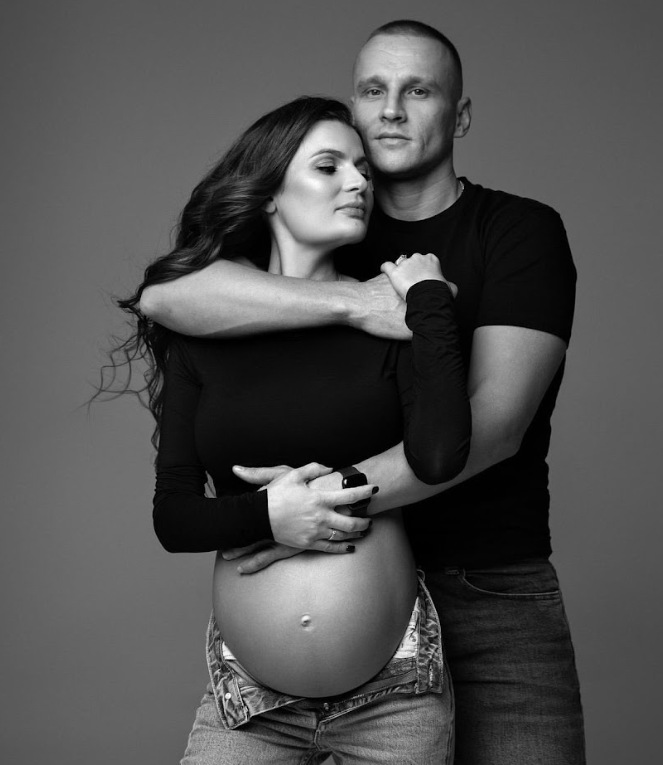 Black and white maternity photography series showing intimate couple poses with focus on the pregnant belly.