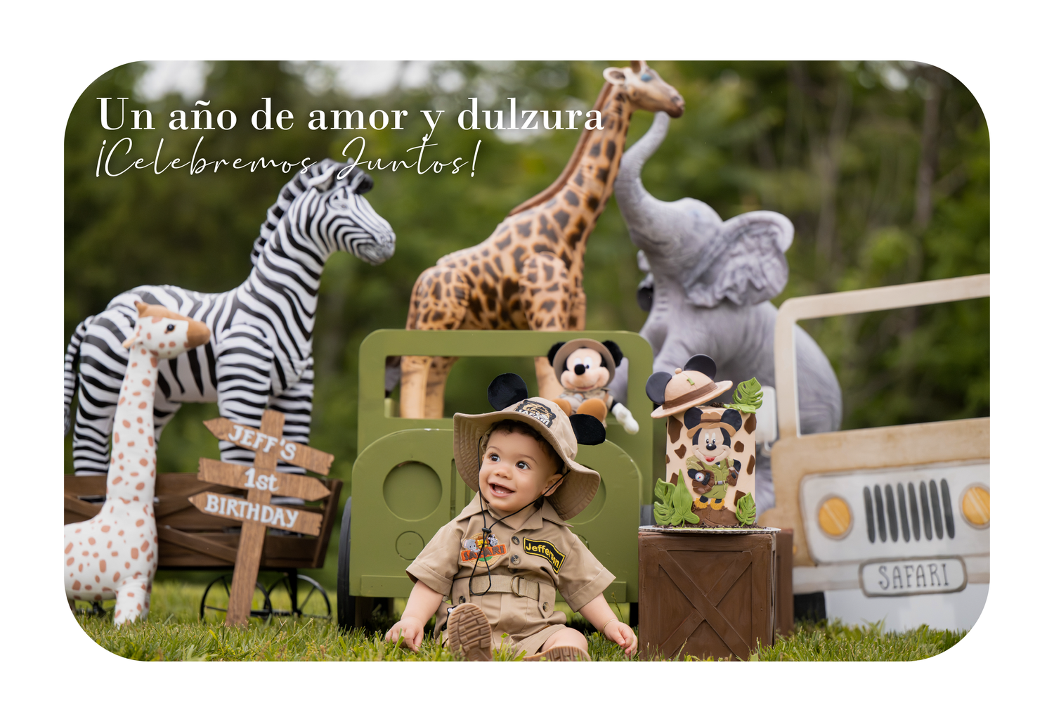 Baby in safari outfit sits among stuffed zoo animals with Spanish text celebrating first birthday.