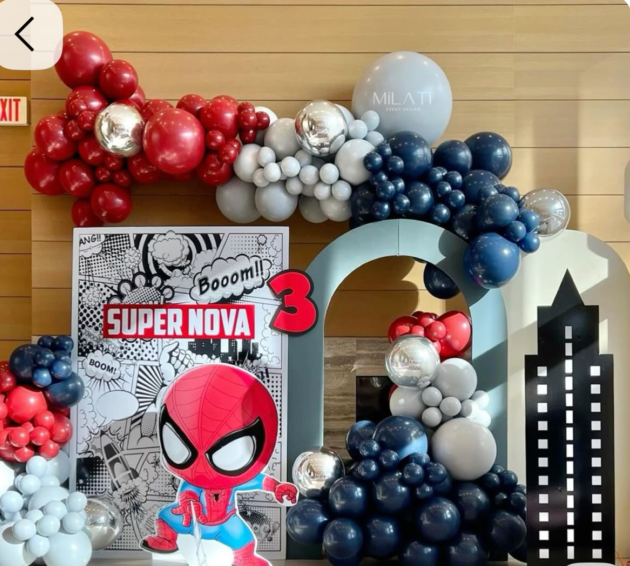 Spider-Man themed 3rd birthday party with red, navy, and silver balloon garland arch and Super Nova banner.