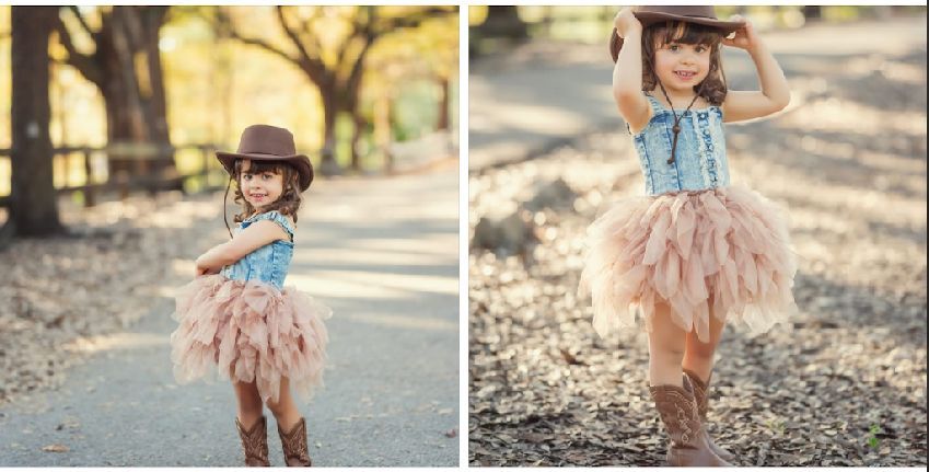 A whimsical western-inspired outfit featuring a blue top and flowing peach tulle skirt in an outdoor setting.