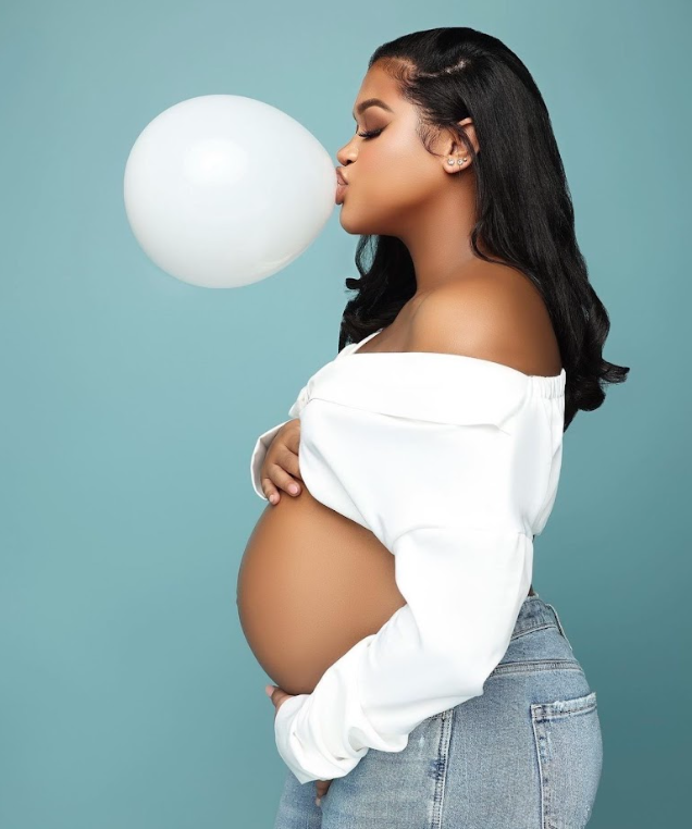 A sequence of pregnancy progression photos showing a woman in a white top and jeans against a blue background.