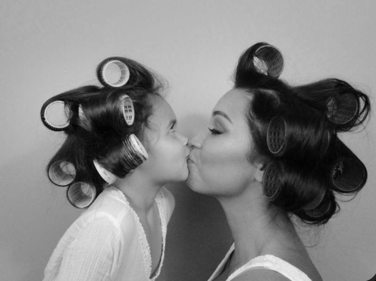 A series of black and white photographs showing a couple in a romantic kissing sequence.