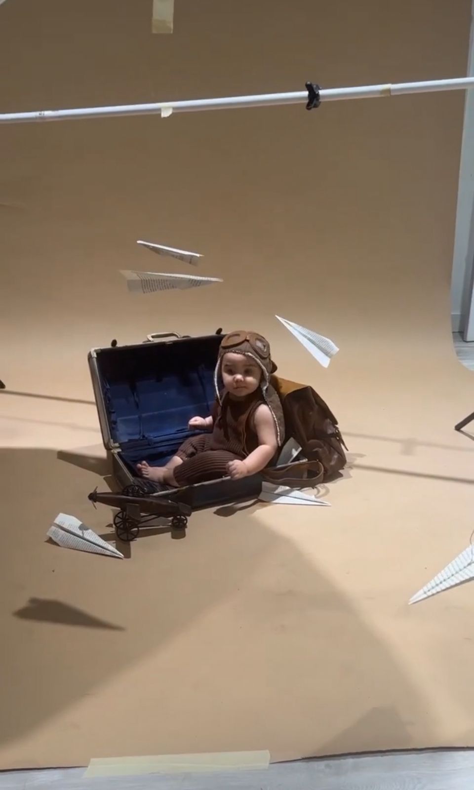 Creative photo series showing paper airplanes flying across a neutral studio backdrop.