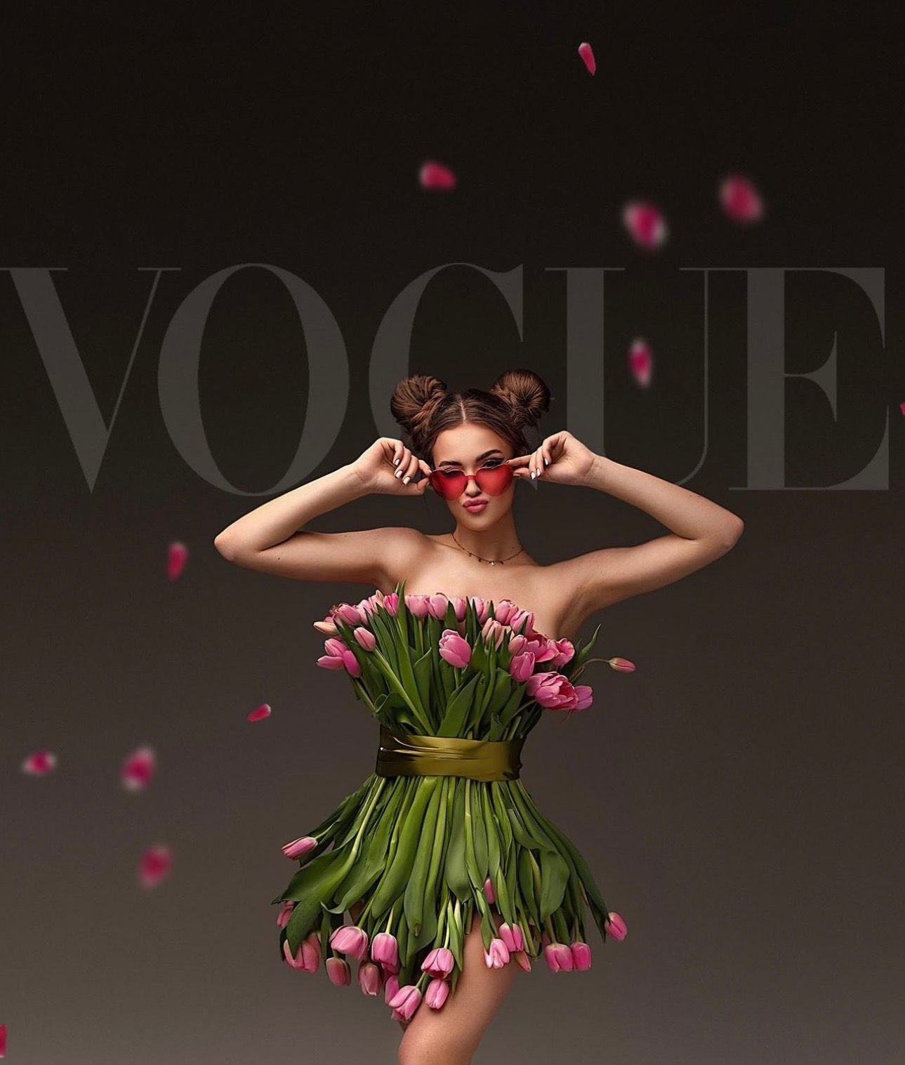 Woman wearing a tulip bouquet dress with red sunglasses posed against Vogue magazine backdrop with falling pink petals.