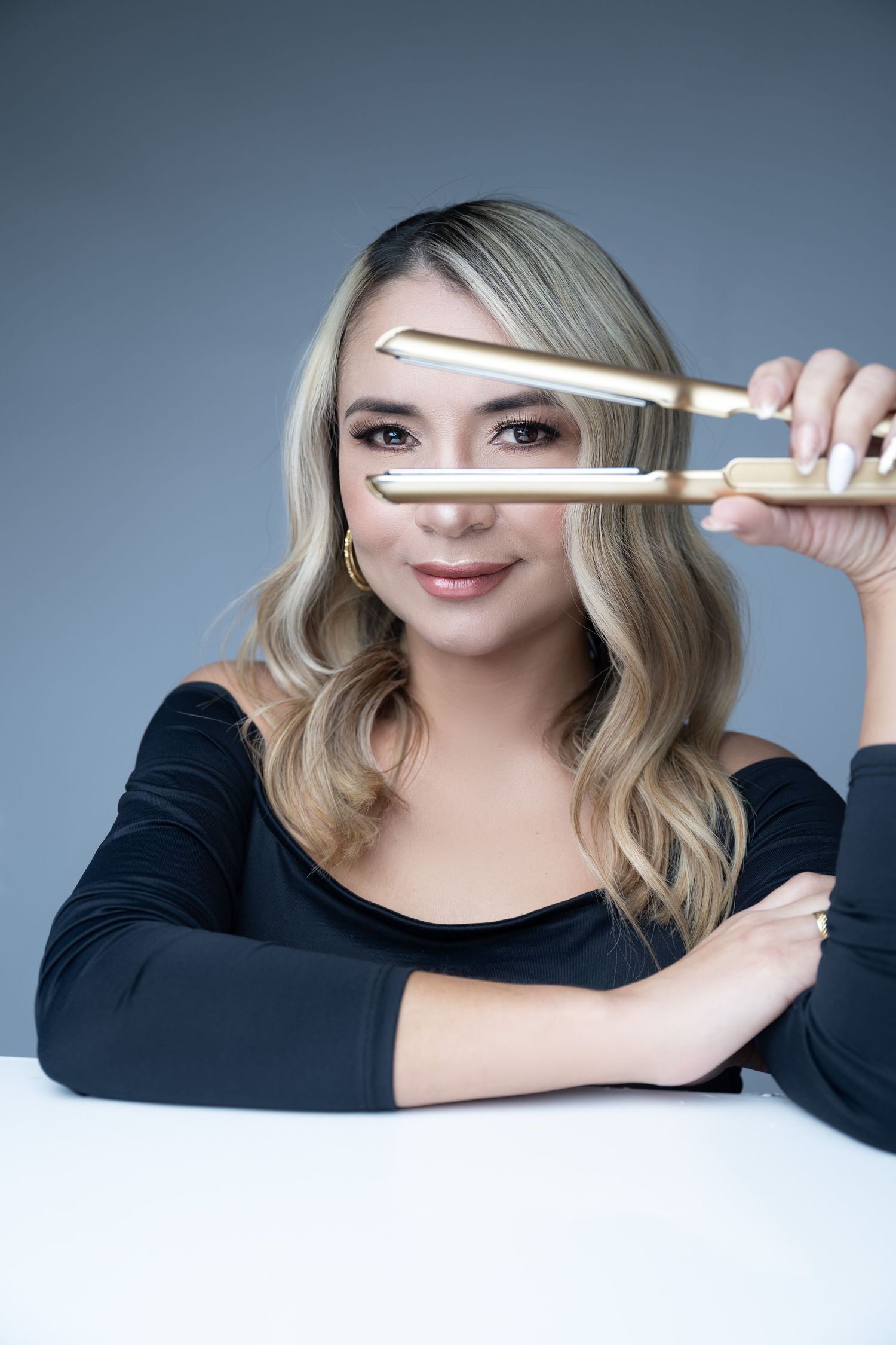 Creative beauty portrait with styling tools framing the composition.