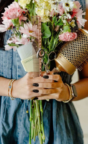 A series of hands holding a beautiful bouquet of pink and white flowers against a denim dress background.