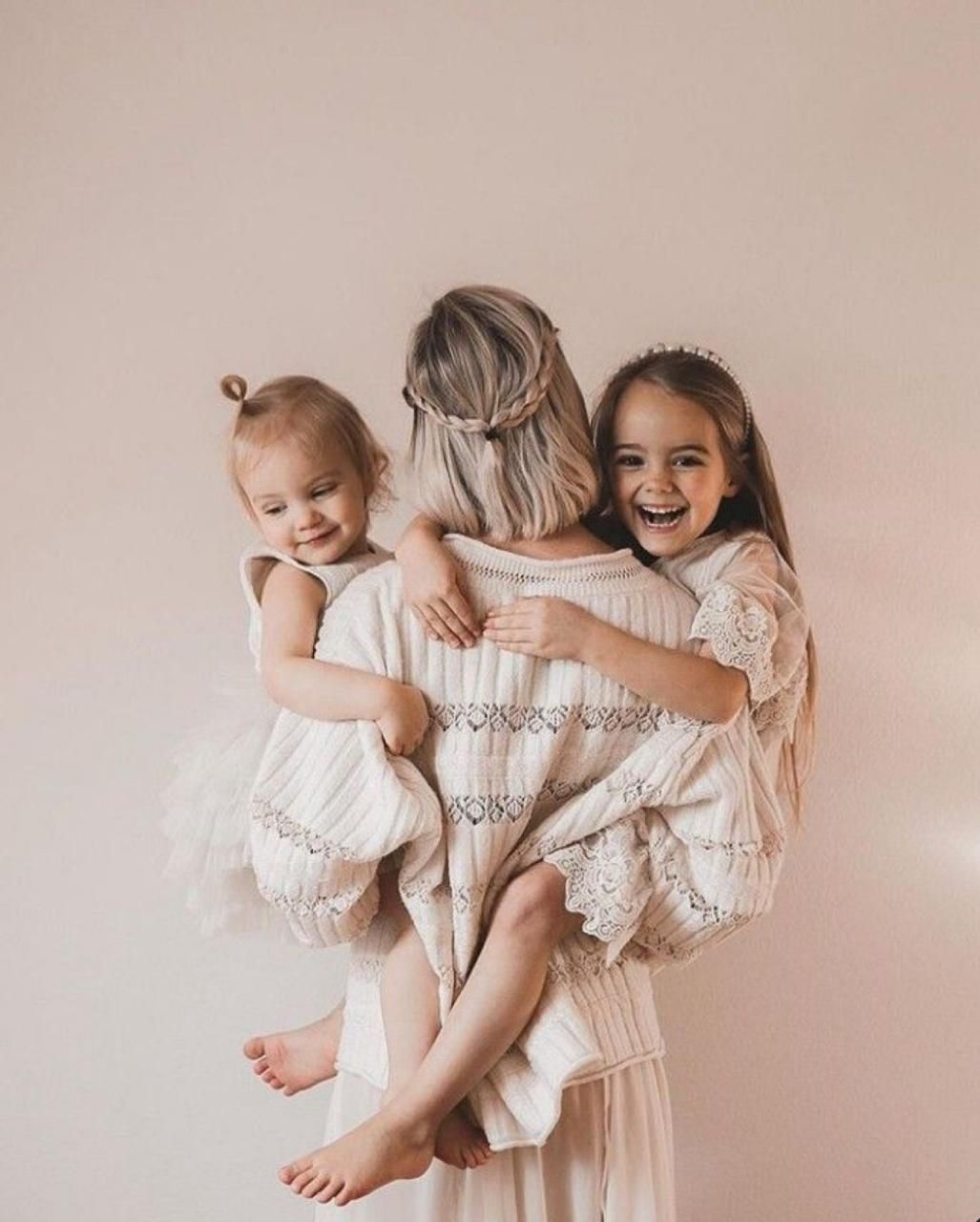 Four connected images show tender embraces and joyful moments in soft pink tones with white clothing.