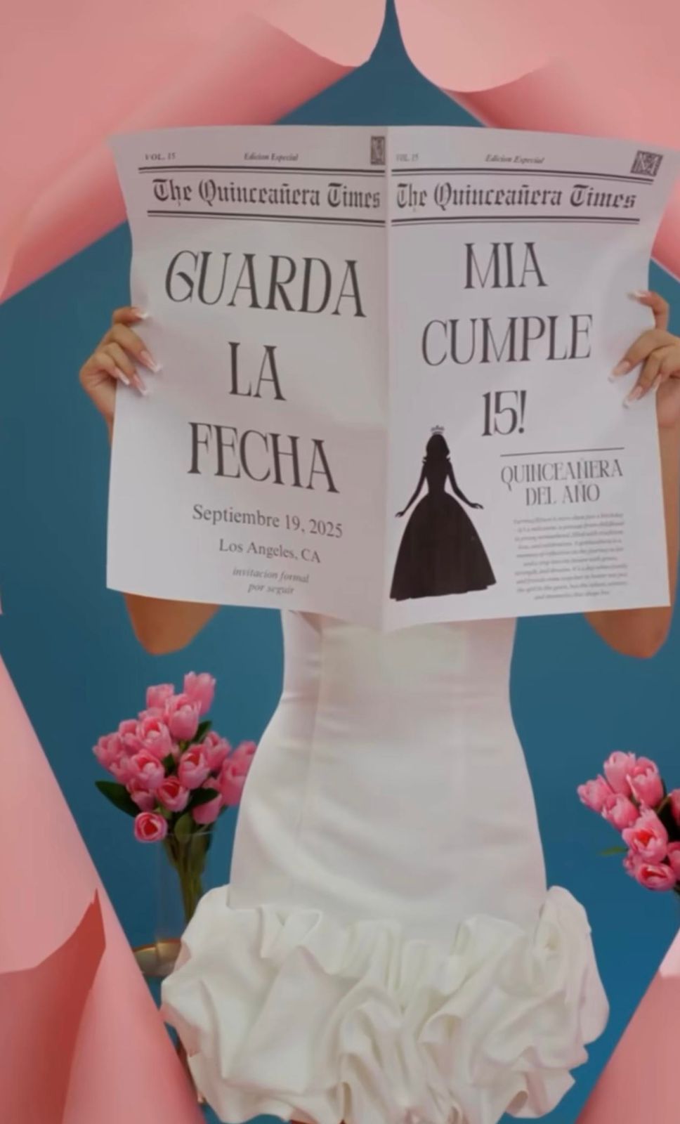 Person in white quinceañera gown holds The Quinceañera Times newspaper announcing Mia's 15th birthday on September 19, 2025.