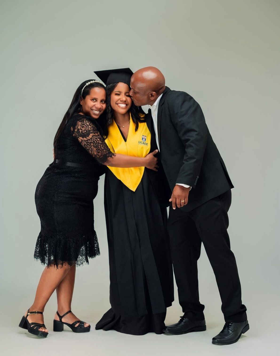 A series of graduation portraits showing a graduate in a black dress and yellow stole posing with family members.