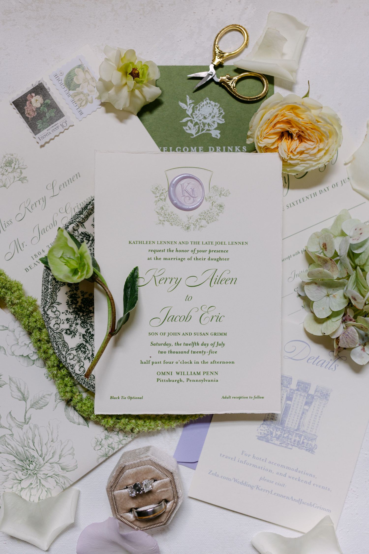 Elegant wedding invitation suite with floral design, rings in hexagonal box, and vintage postage stamps.