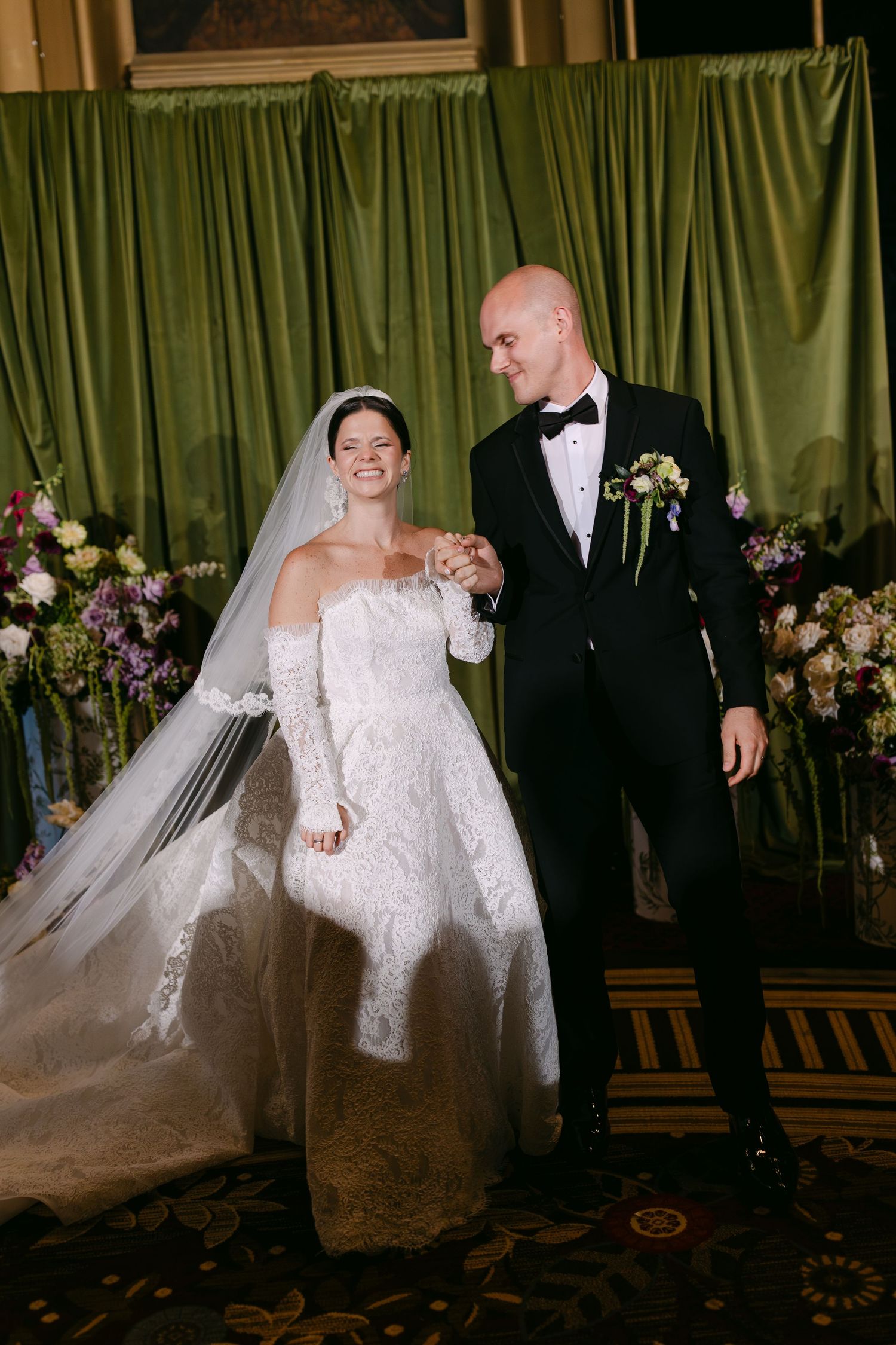 A series of four wedding photos showing a couple in formal attire dancing and twirling on a carpeted ballroom floor.