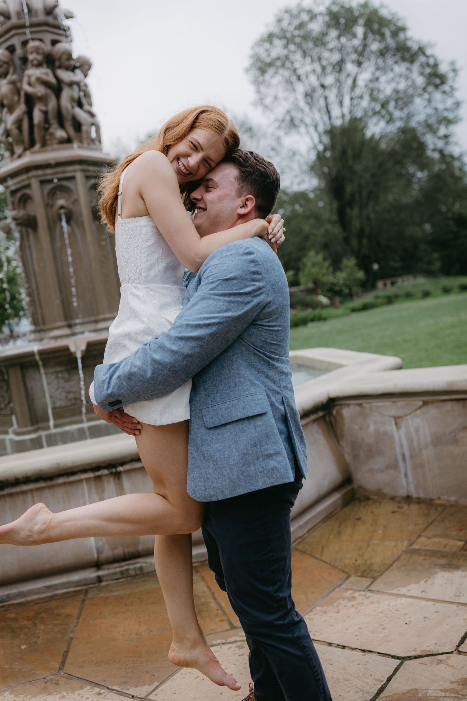 A romantic dance scene captured in four sequential photos at a stone terrace surrounded by greenery.