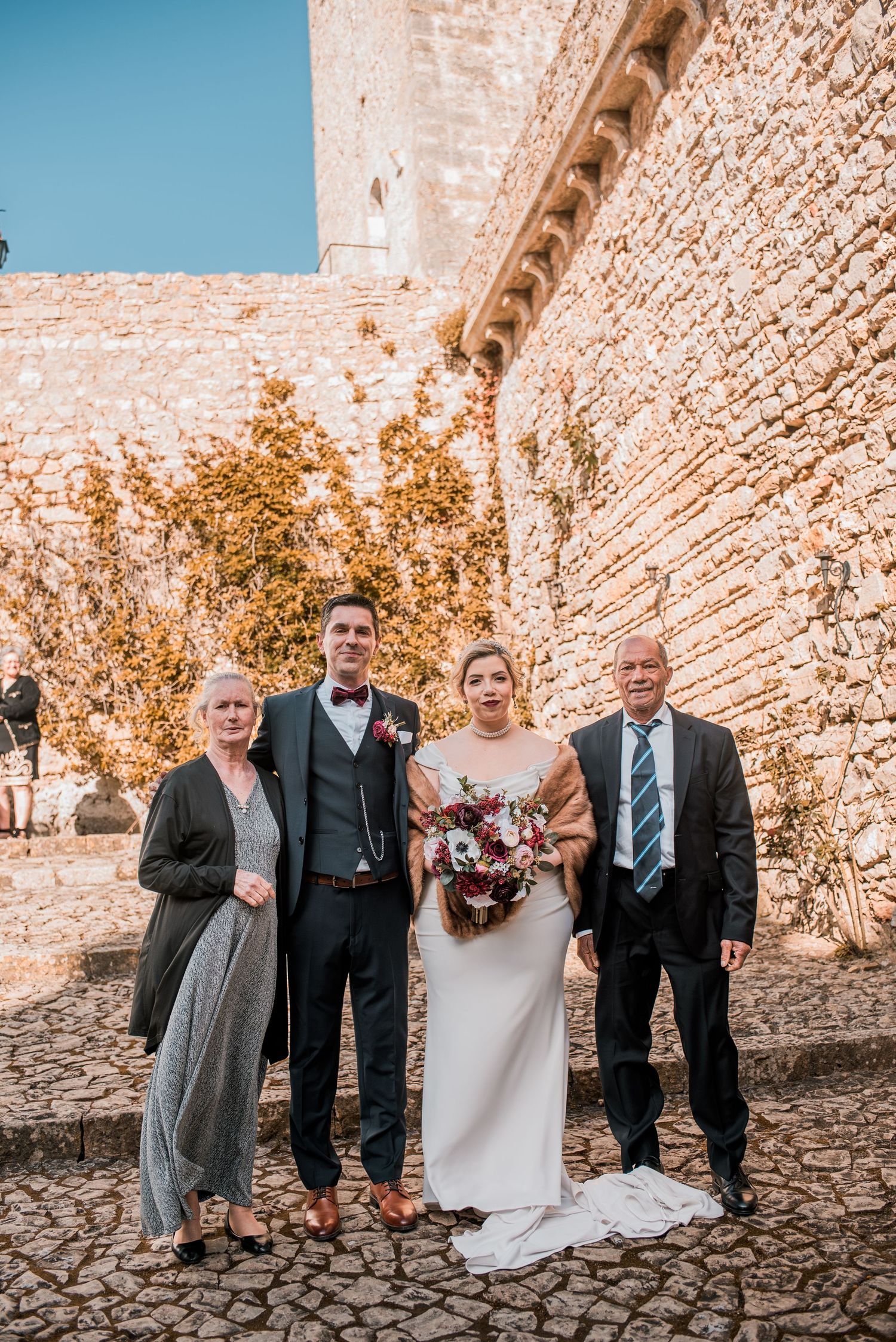 Intimate wedding ceremony at Pousada Castelo de Óbidos with emotional moments and warm atmosphere.