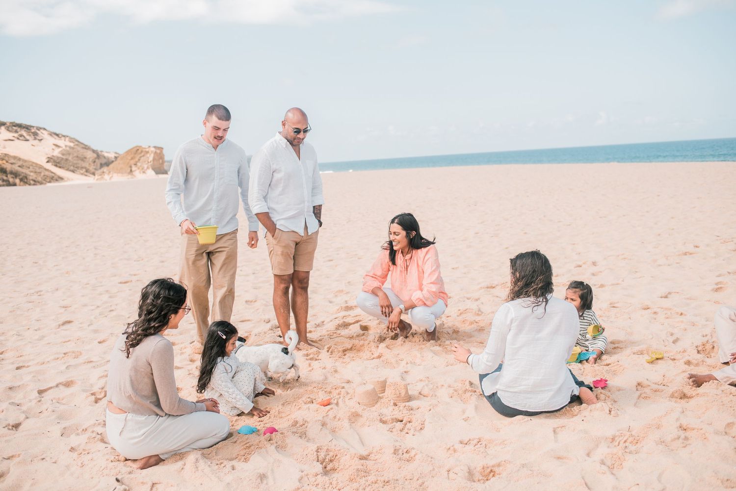 Natural and joyful family moments captured on a Portuguese beach.