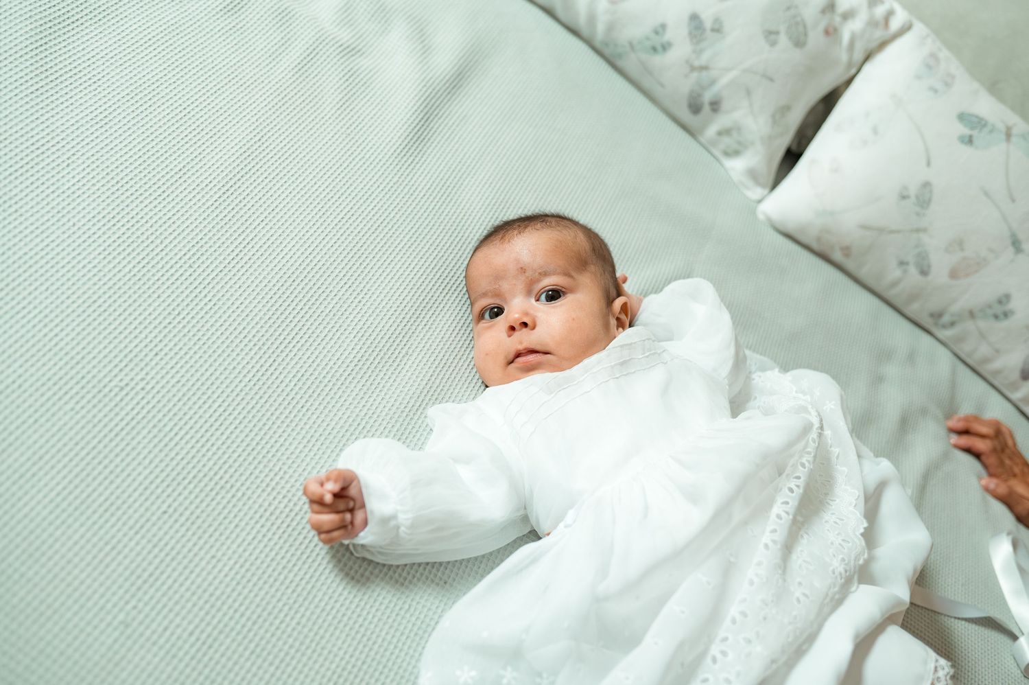 Baby baptism photography capturing natural and heartfelt family moments.