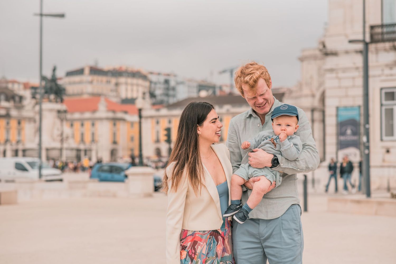 Parents and children sharing a joyful moment during a family session in Lisbon.