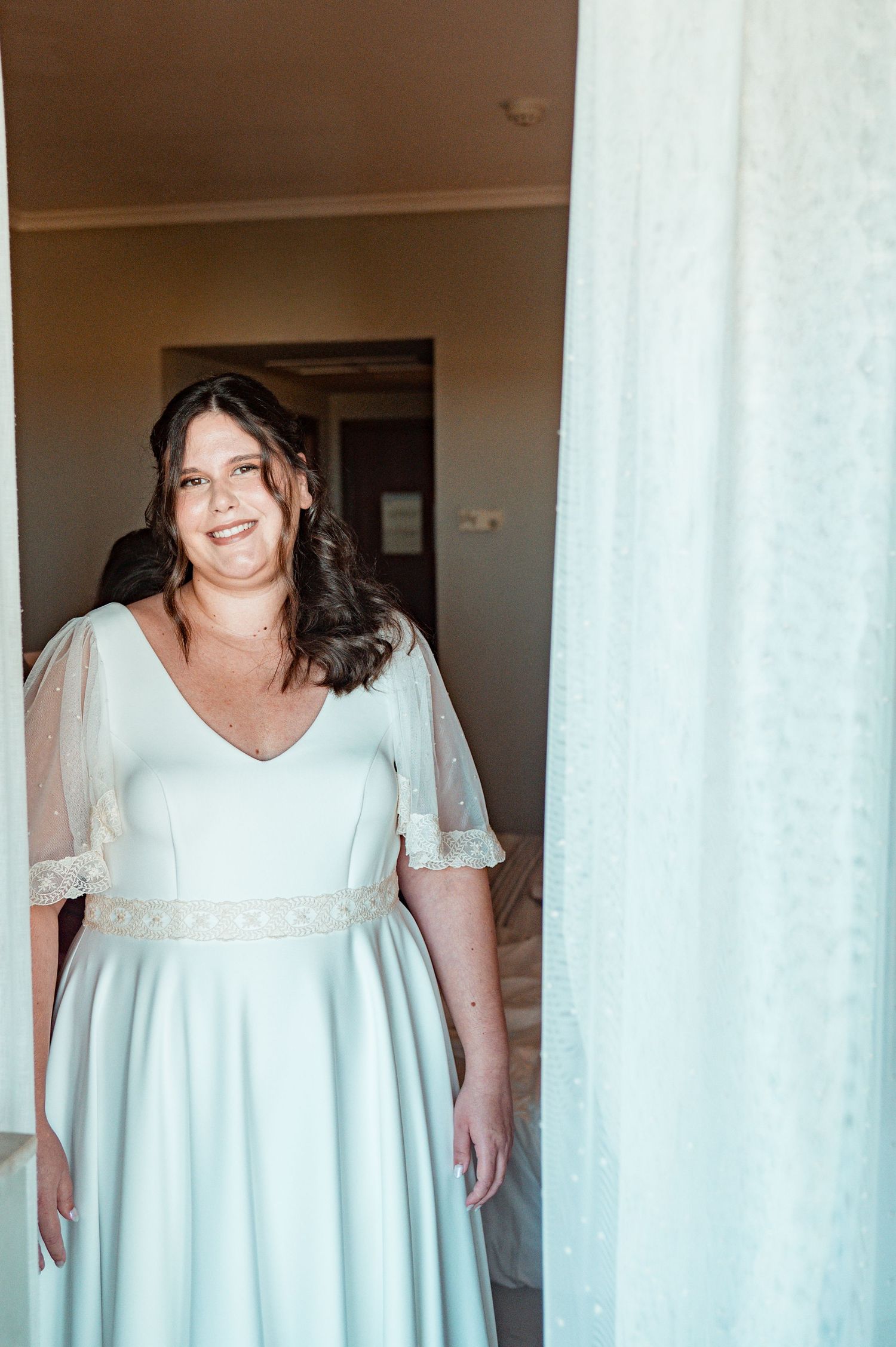 Bride in her wedding preparation in the historic center of Évora, Portugal.