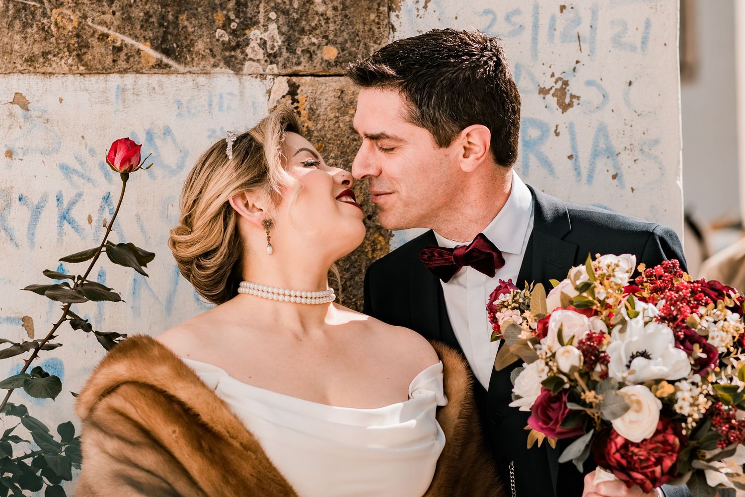 Destination wedding couple sharing a quiet moment in Óbidos, Portugal.
