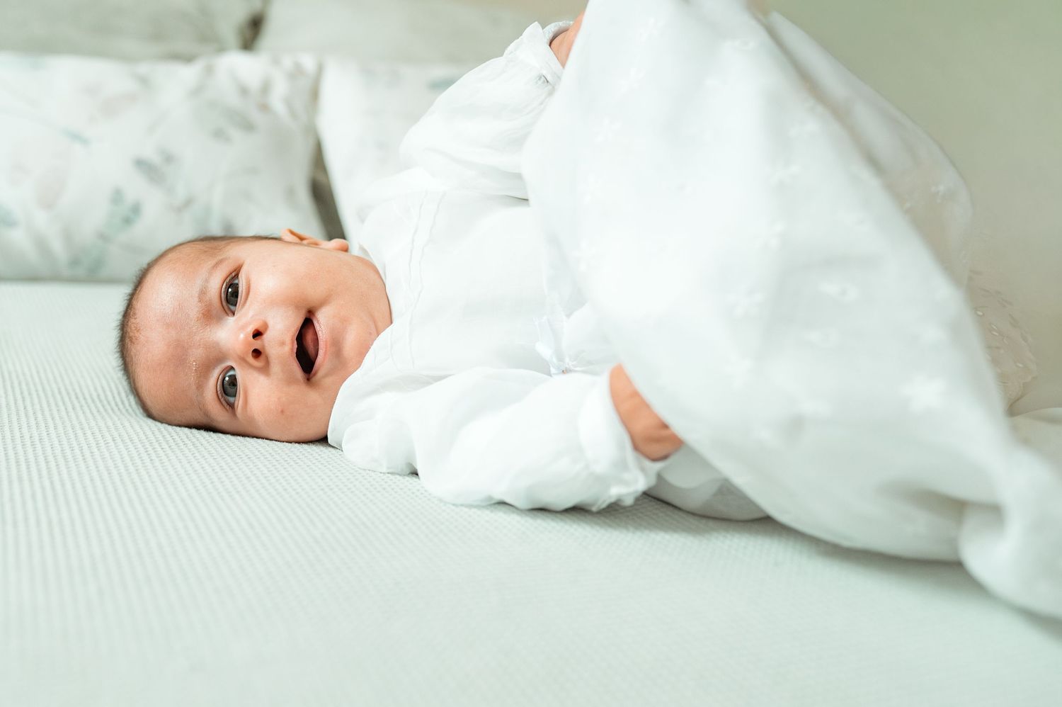 Baby baptism photography capturing natural and heartfelt family moments.