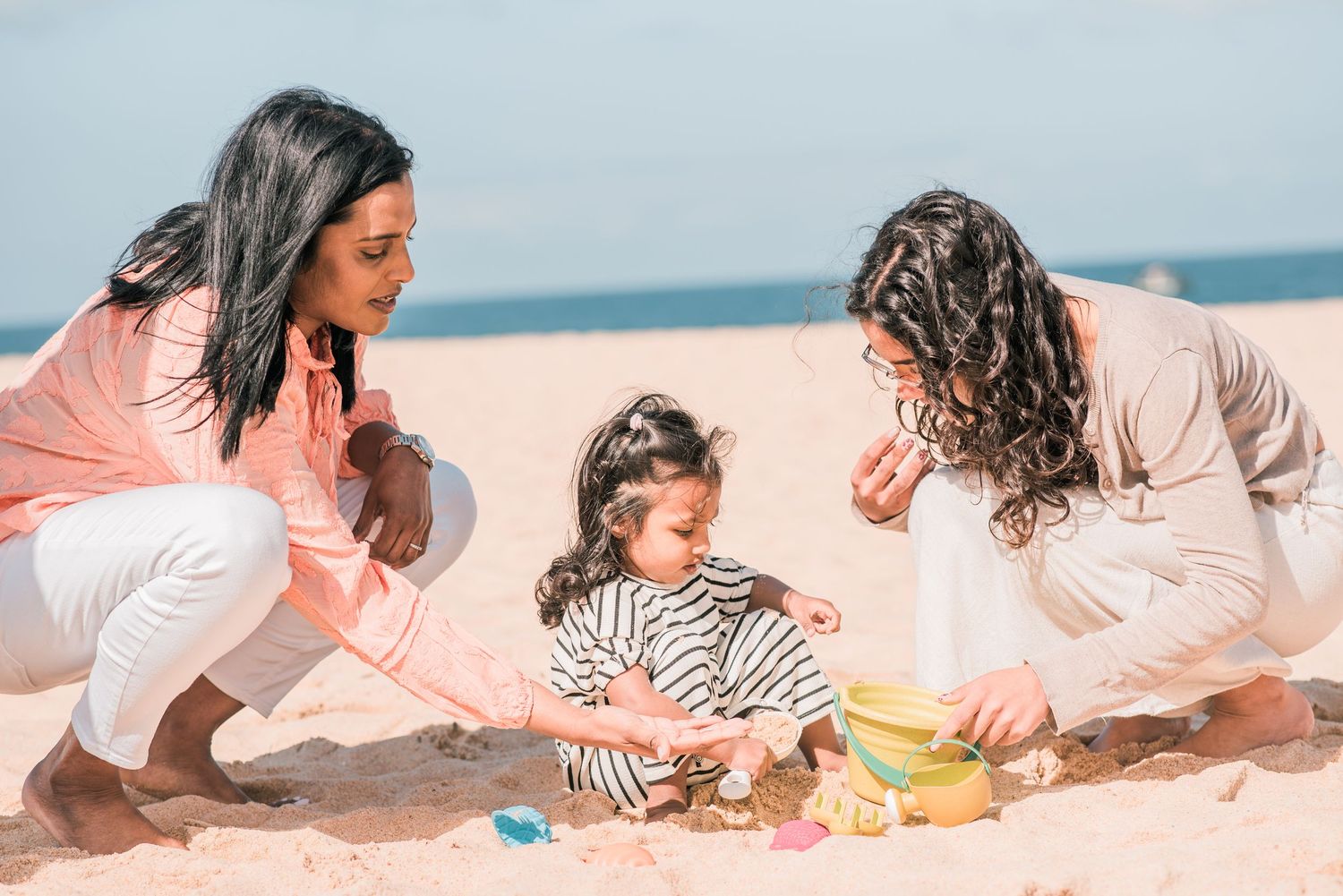 Natural and joyful family moments captured on a Portuguese beach.