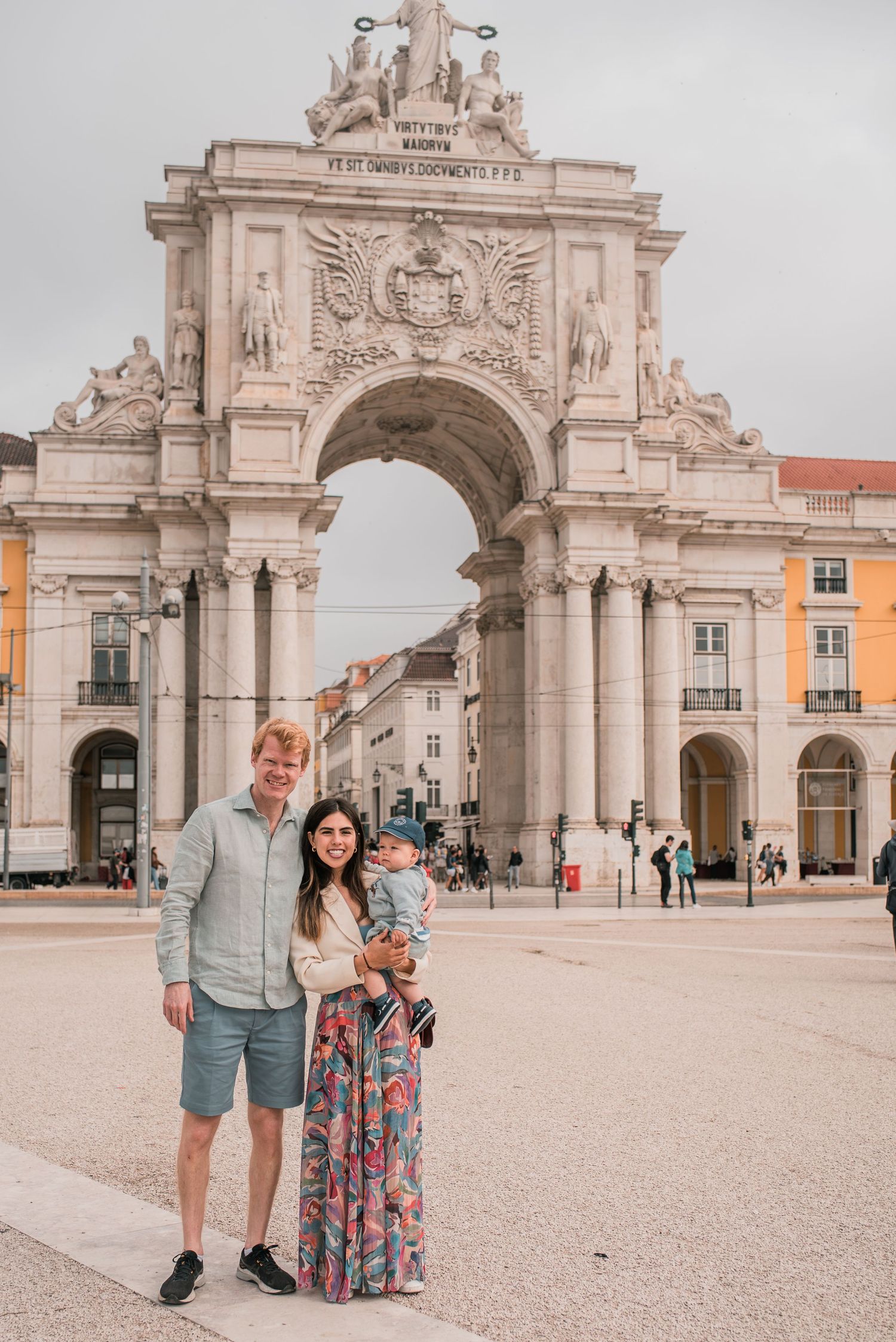 Parents and children sharing a joyful moment during a family session in Lisbon.