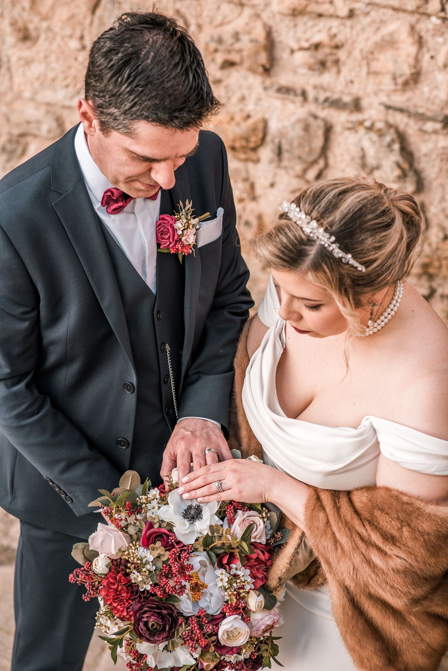 Intimate destination wedding in Óbidos, Portugal, with bride and groom walking through the medieval streets at sunset.