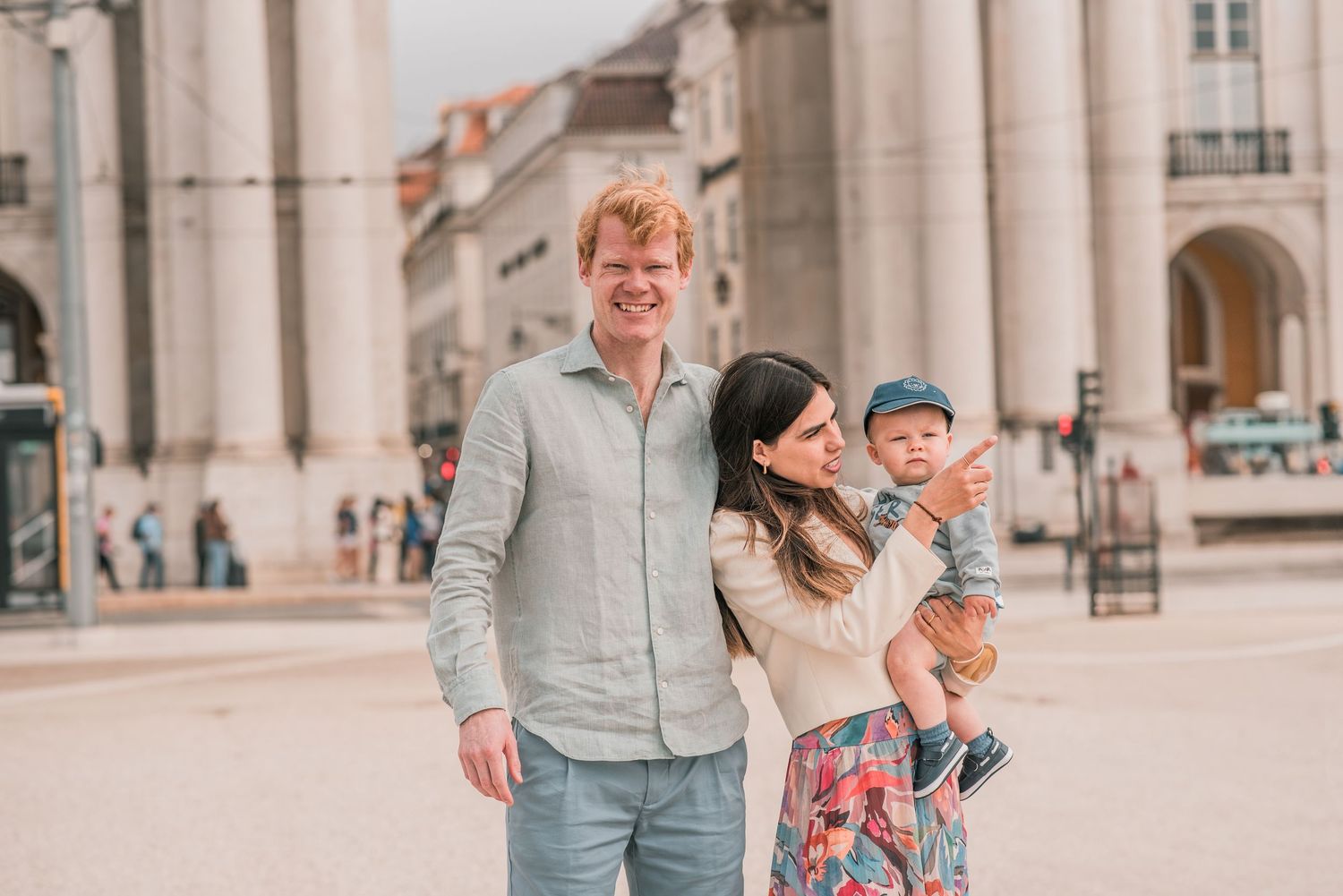 Parents and children sharing a joyful moment during a family session in Lisbon.