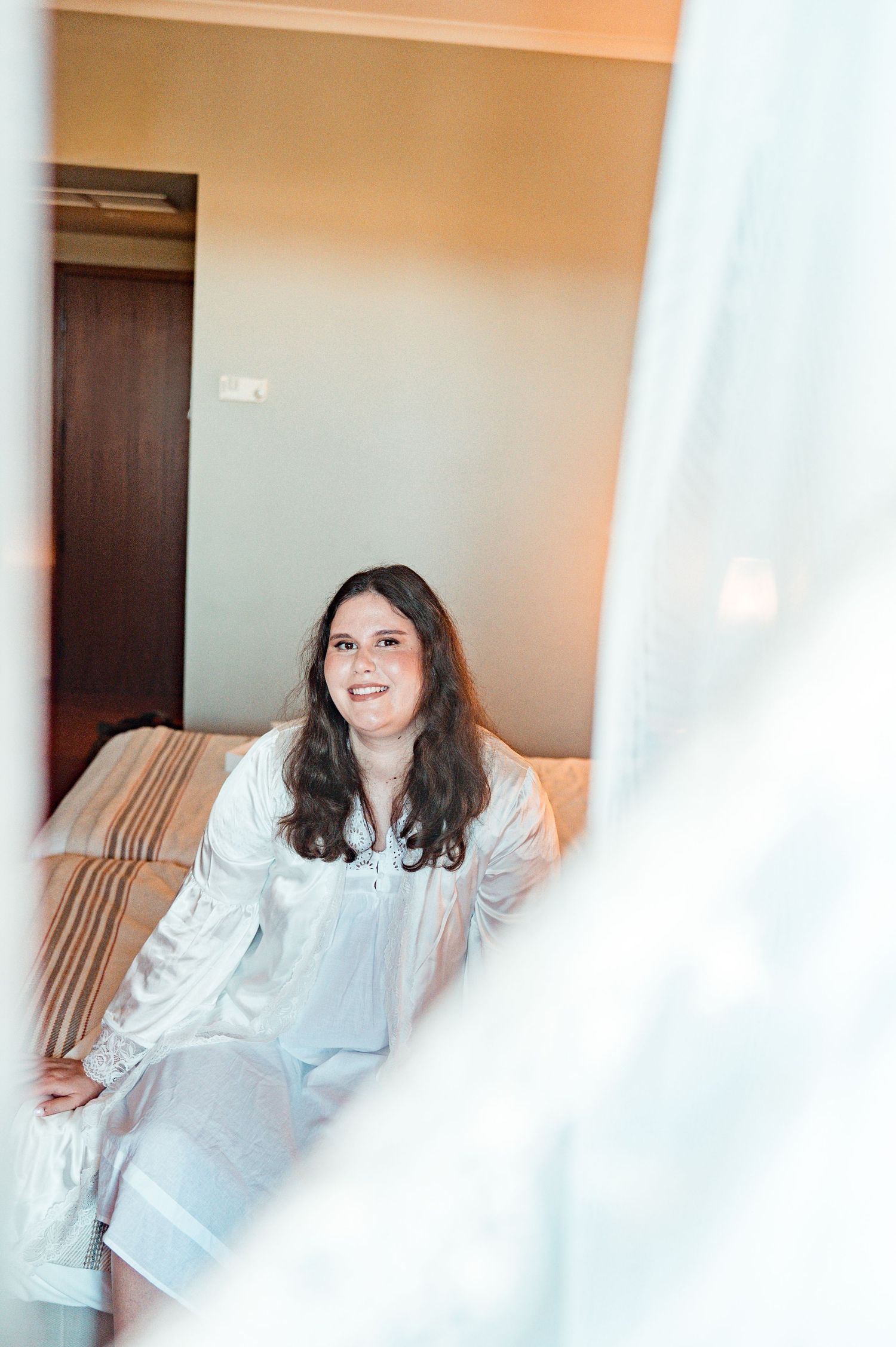 Bride in her wedding preparation in the historic center of Évora, Portugal.