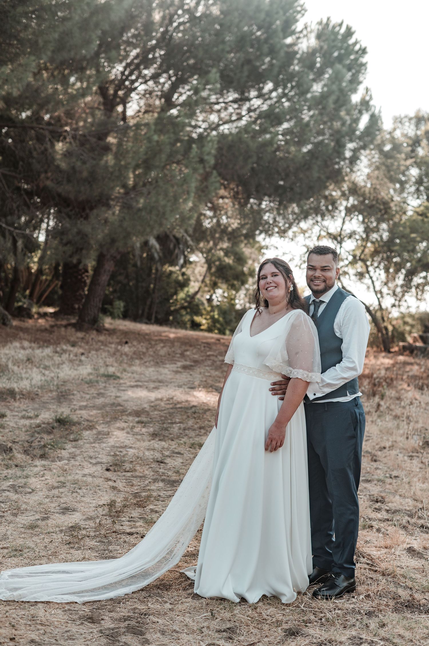 Newlyweds embracing in Évora during a relaxed and emotional sunset session.