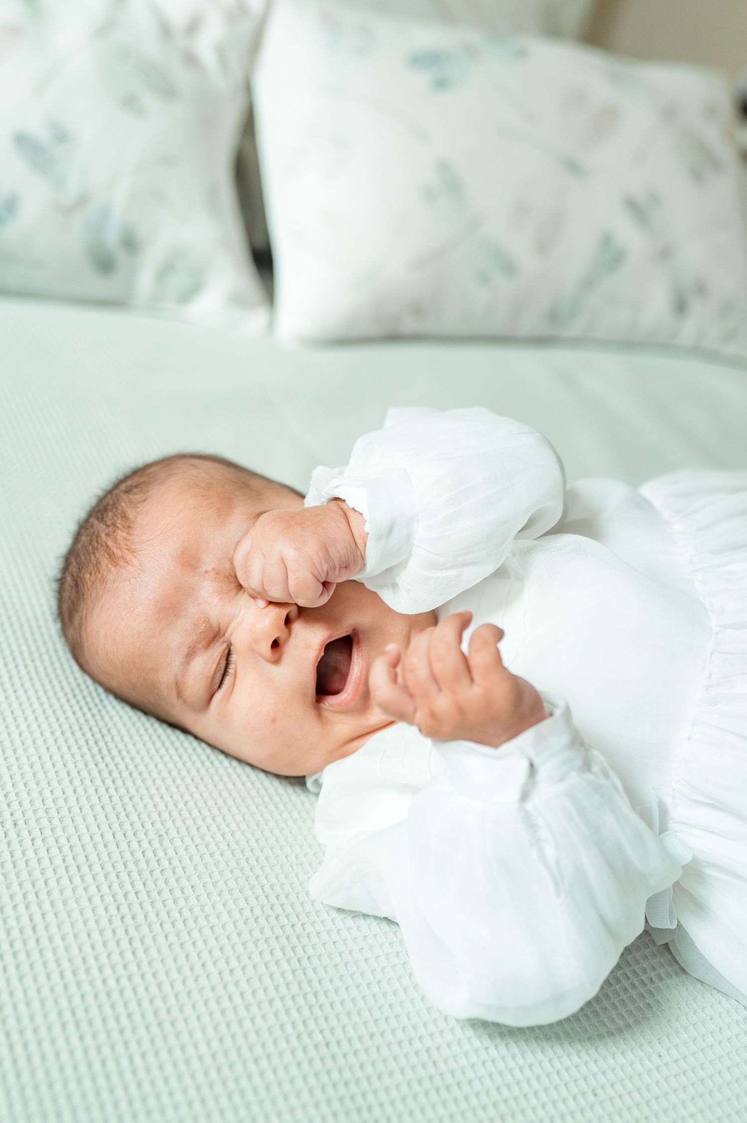 Baby baptism photography capturing natural and heartfelt family moments.