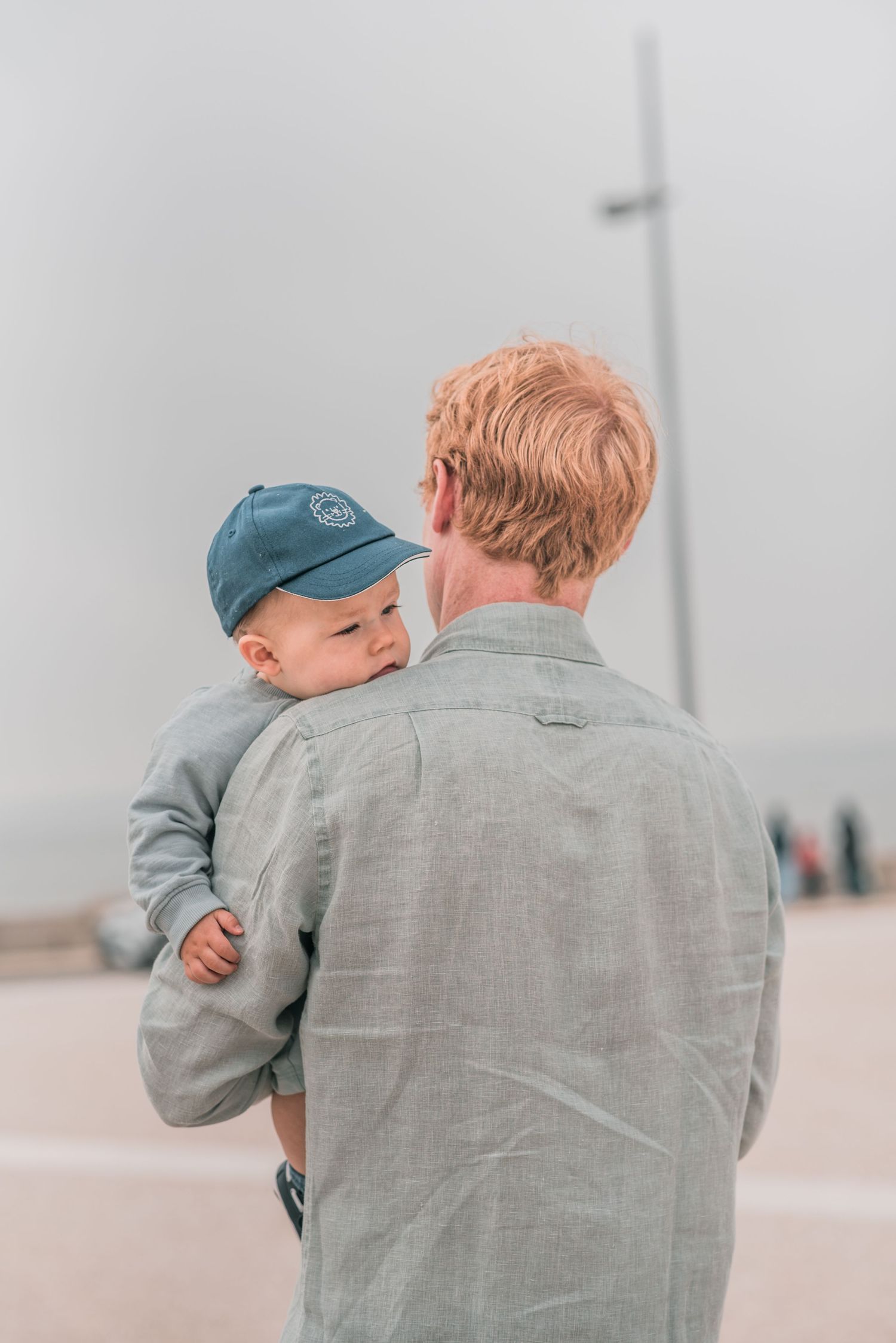 Parents and children sharing a joyful moment during a family session in Lisbon.