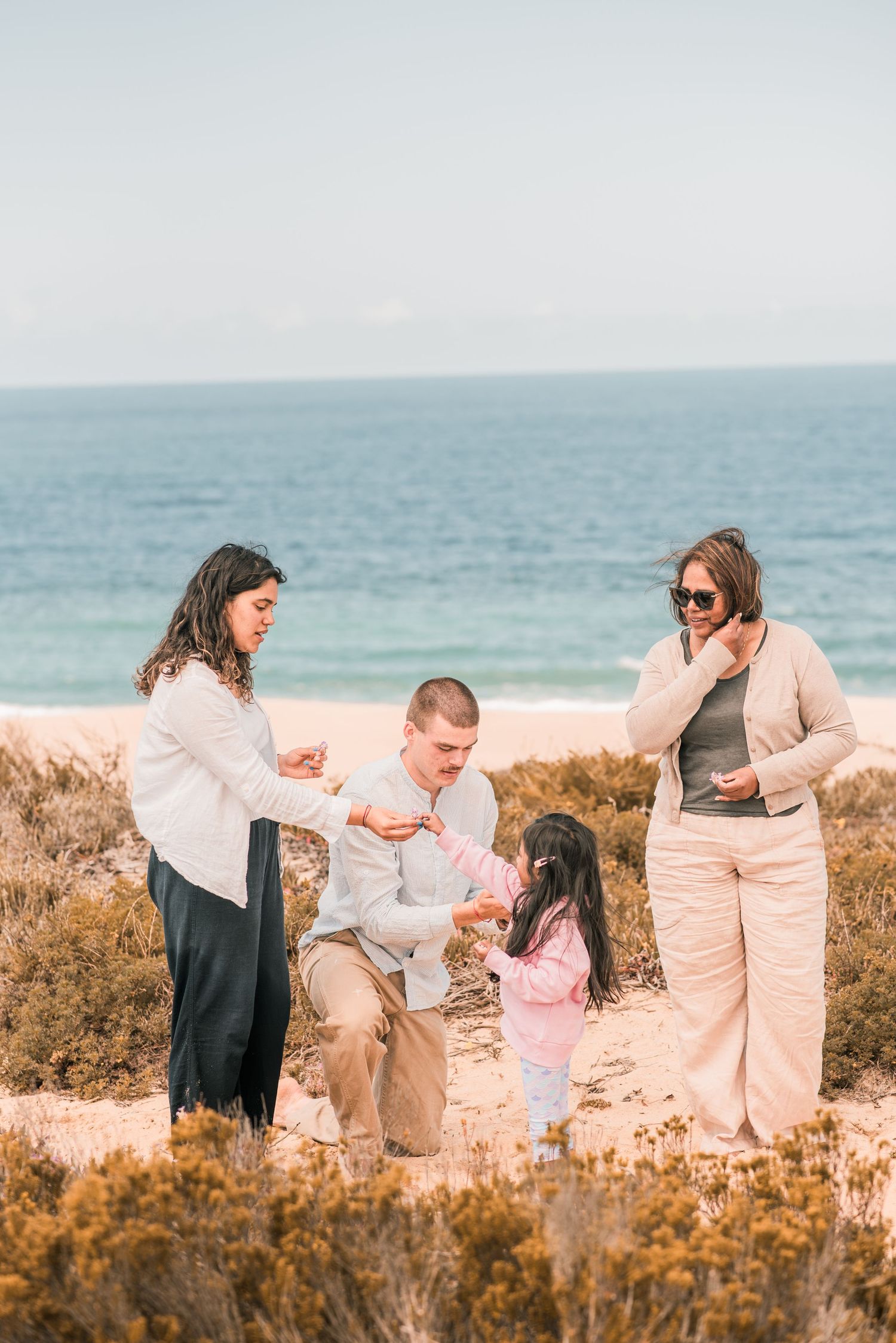 Natural and joyful family moments captured on a Portuguese beach.