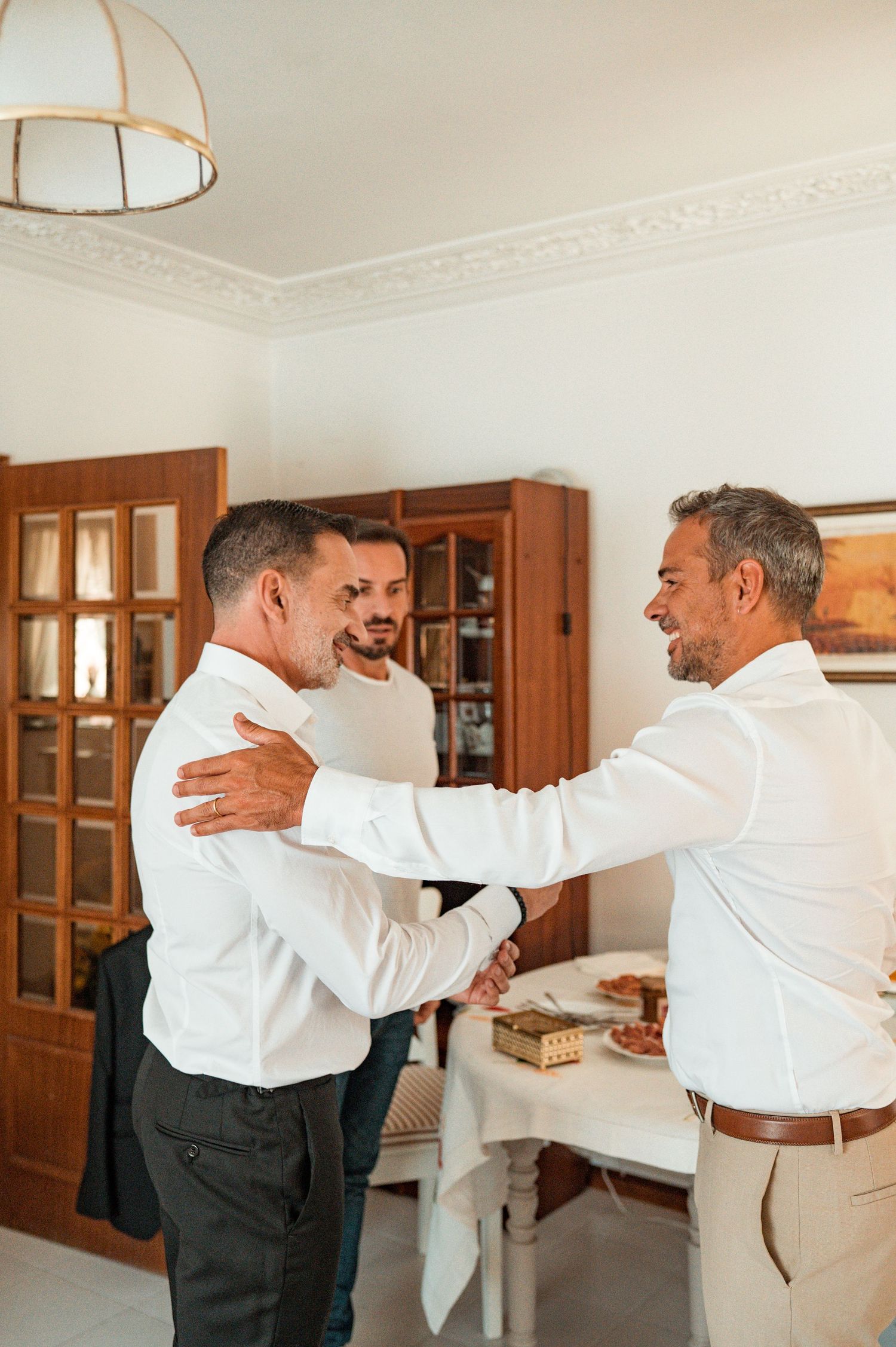Elegant groom during destination wedding preparations in Cascais, Portugal.