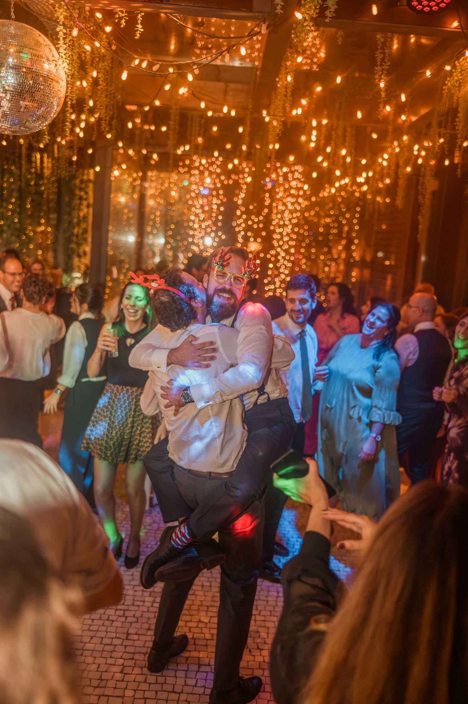 Winter wedding in Porto, Portugal, with Christmas lights and festive decorations in December.