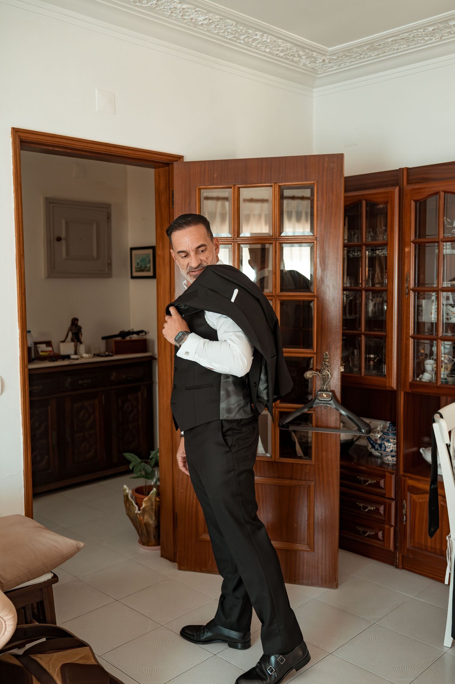 Elegant groom during destination wedding preparations in Cascais, Portugal.