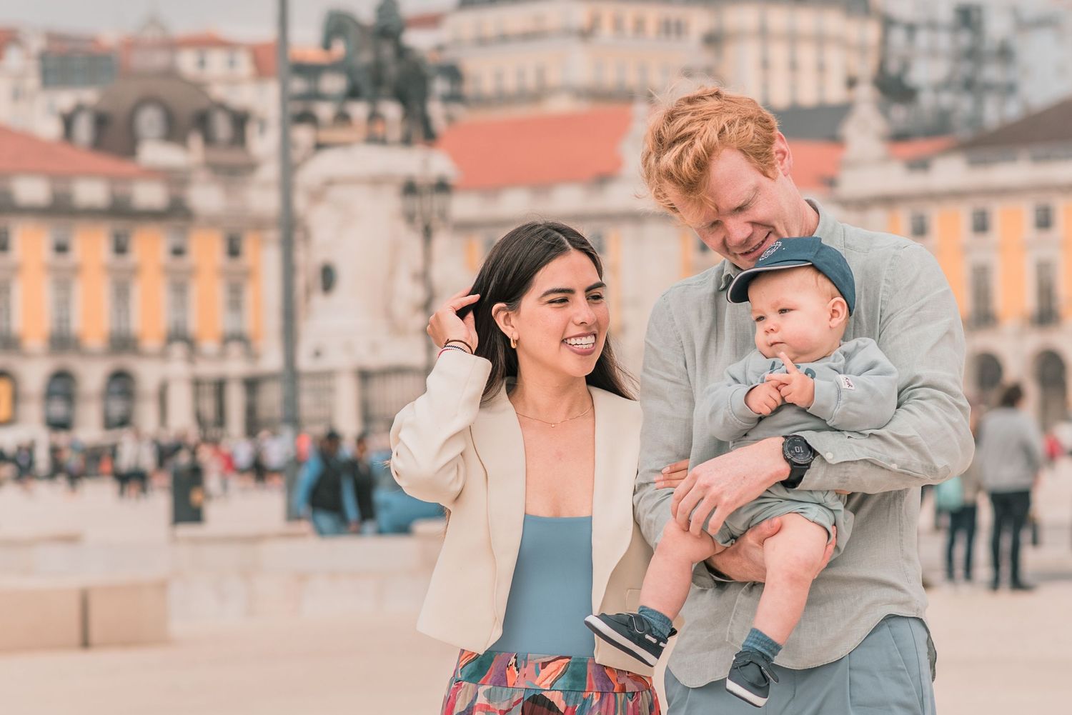 Parents and children sharing a joyful moment during a family session in Lisbon.