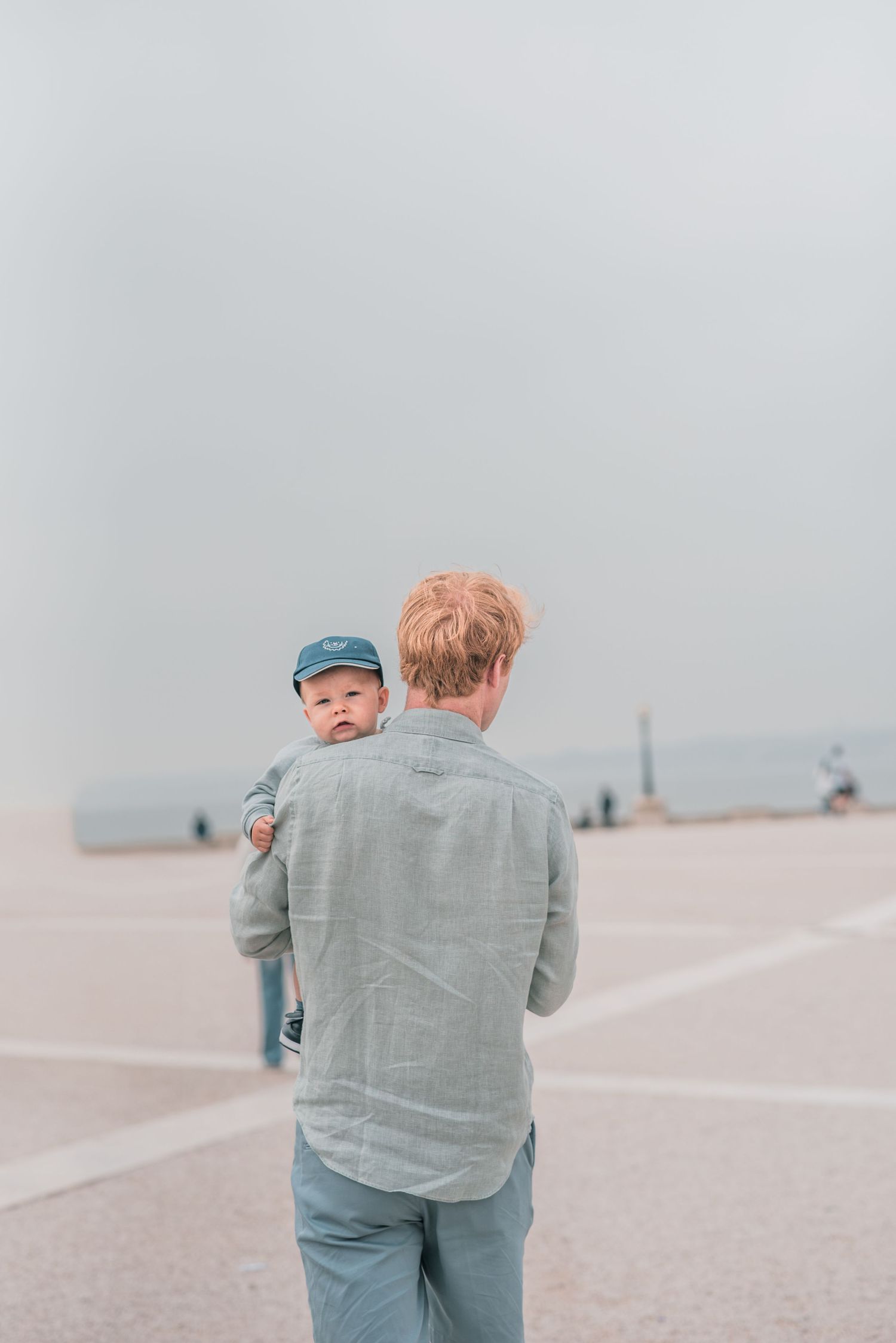 Parents and children sharing a joyful moment during a family session in Lisbon.