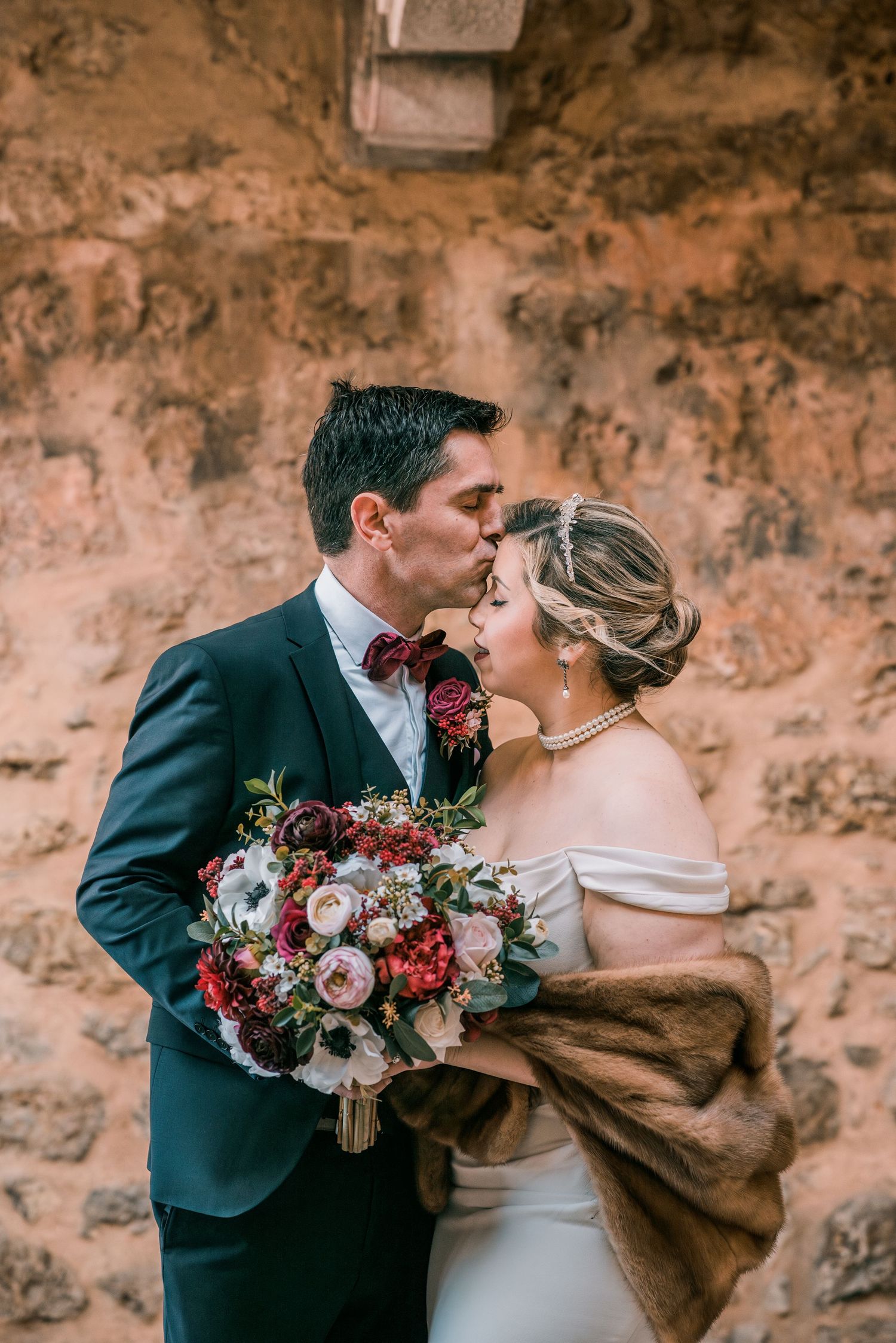 Destination wedding couple sharing a quiet moment in Óbidos, Portugal.