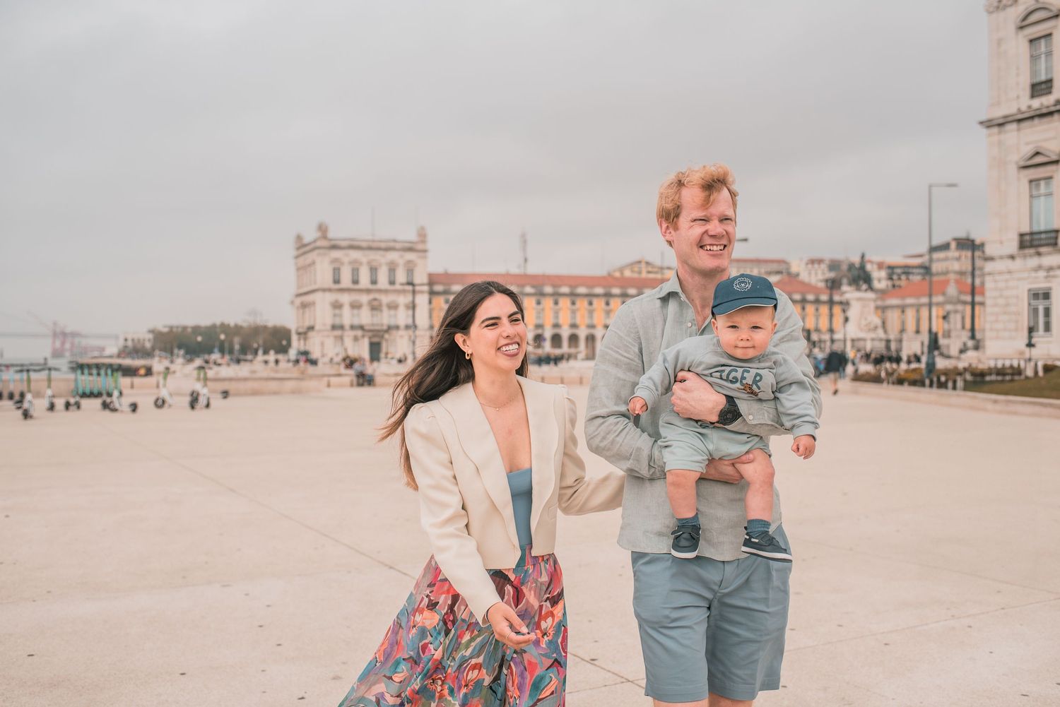 Parents and children sharing a joyful moment during a family session in Lisbon.