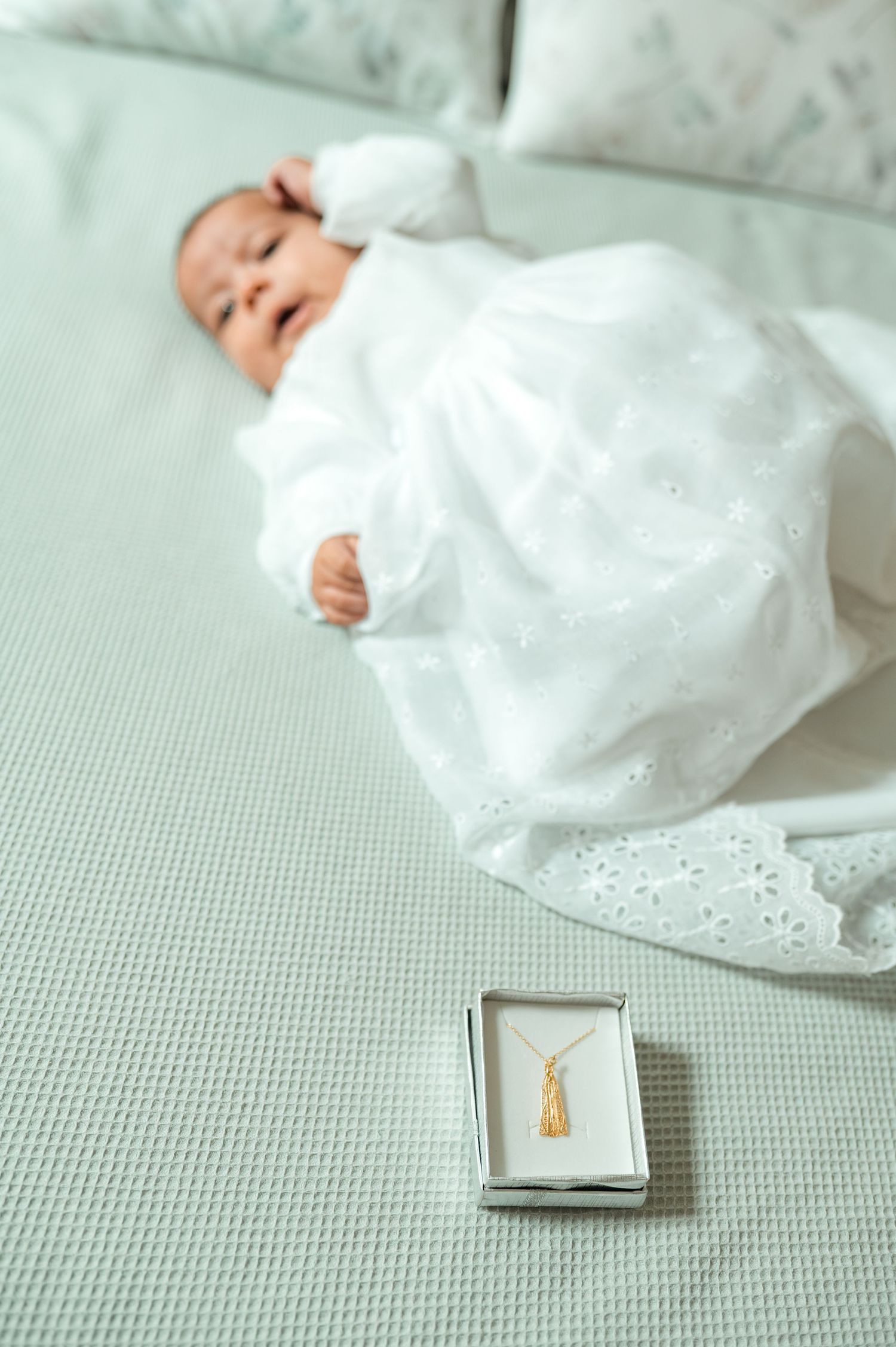 Baby baptism photography capturing natural and heartfelt family moments.