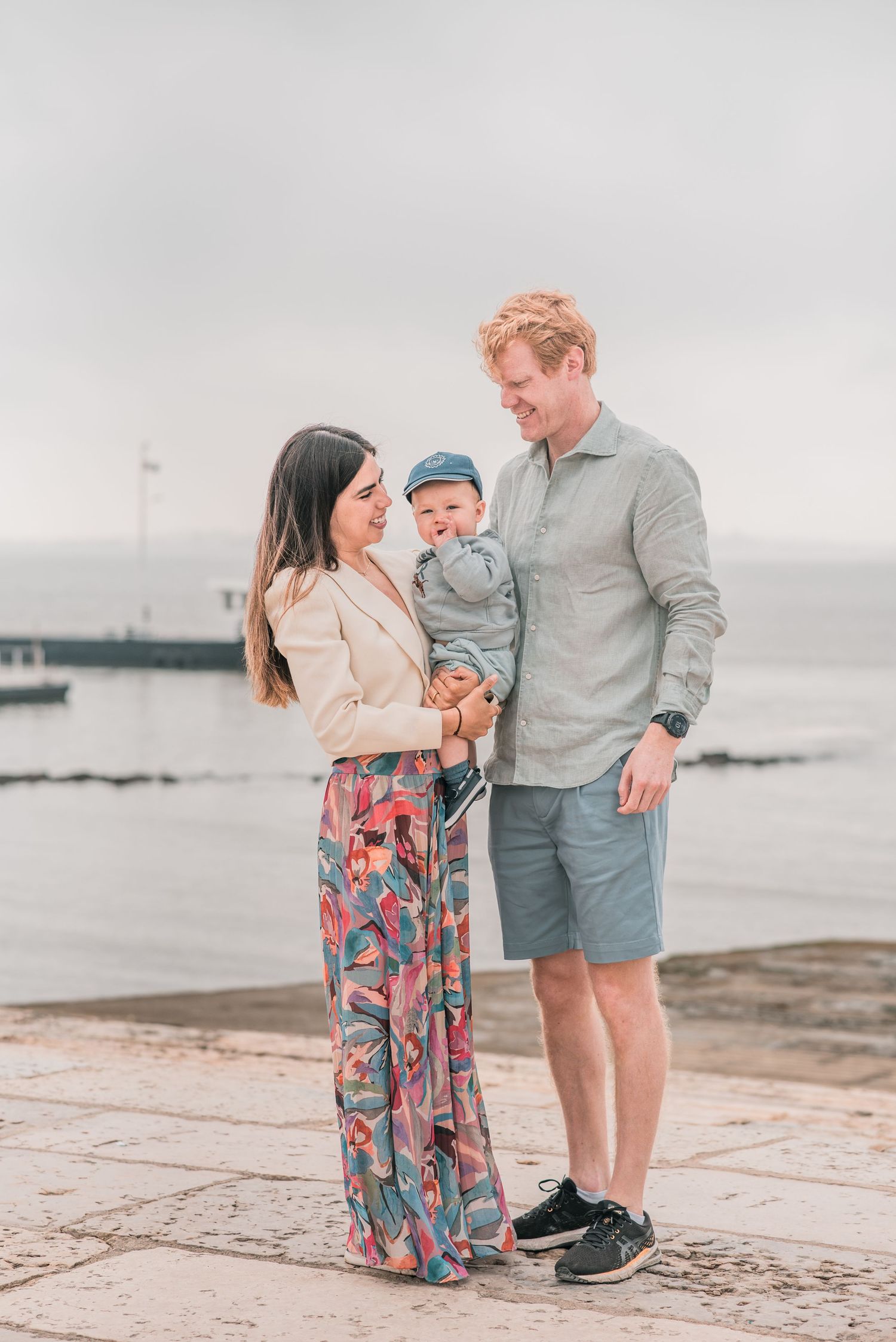 Parents and children sharing a joyful moment during a family session in Lisbon.