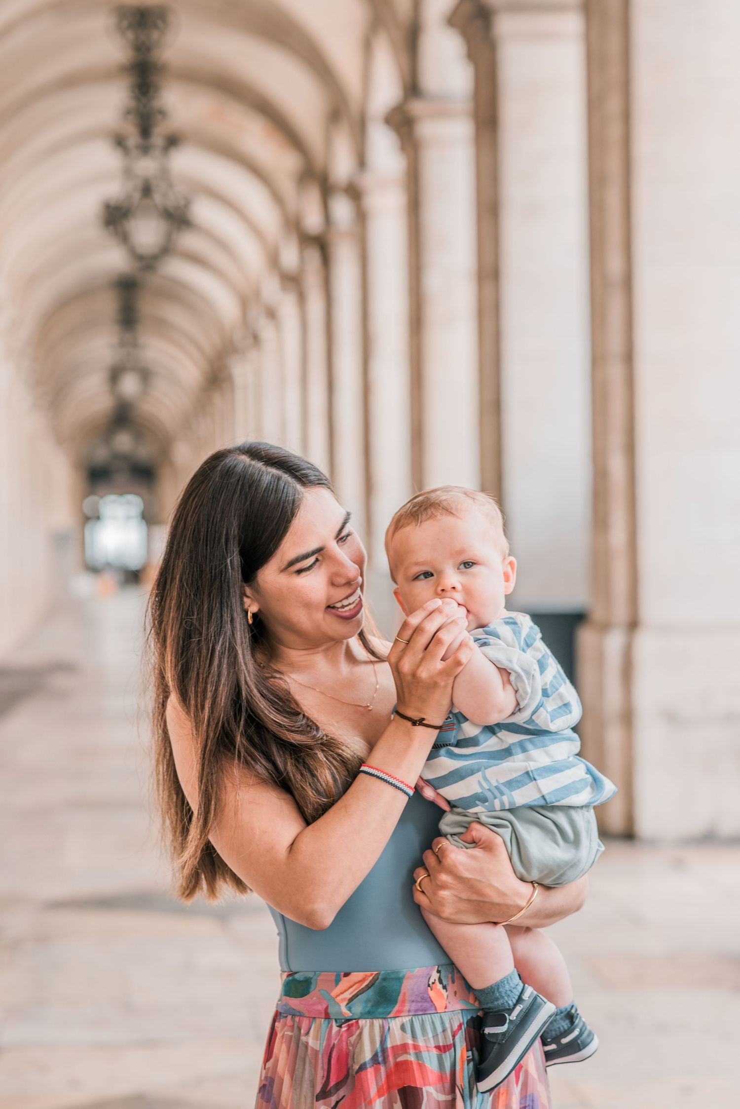 Parents and children sharing a joyful moment during a family session in Lisbon.