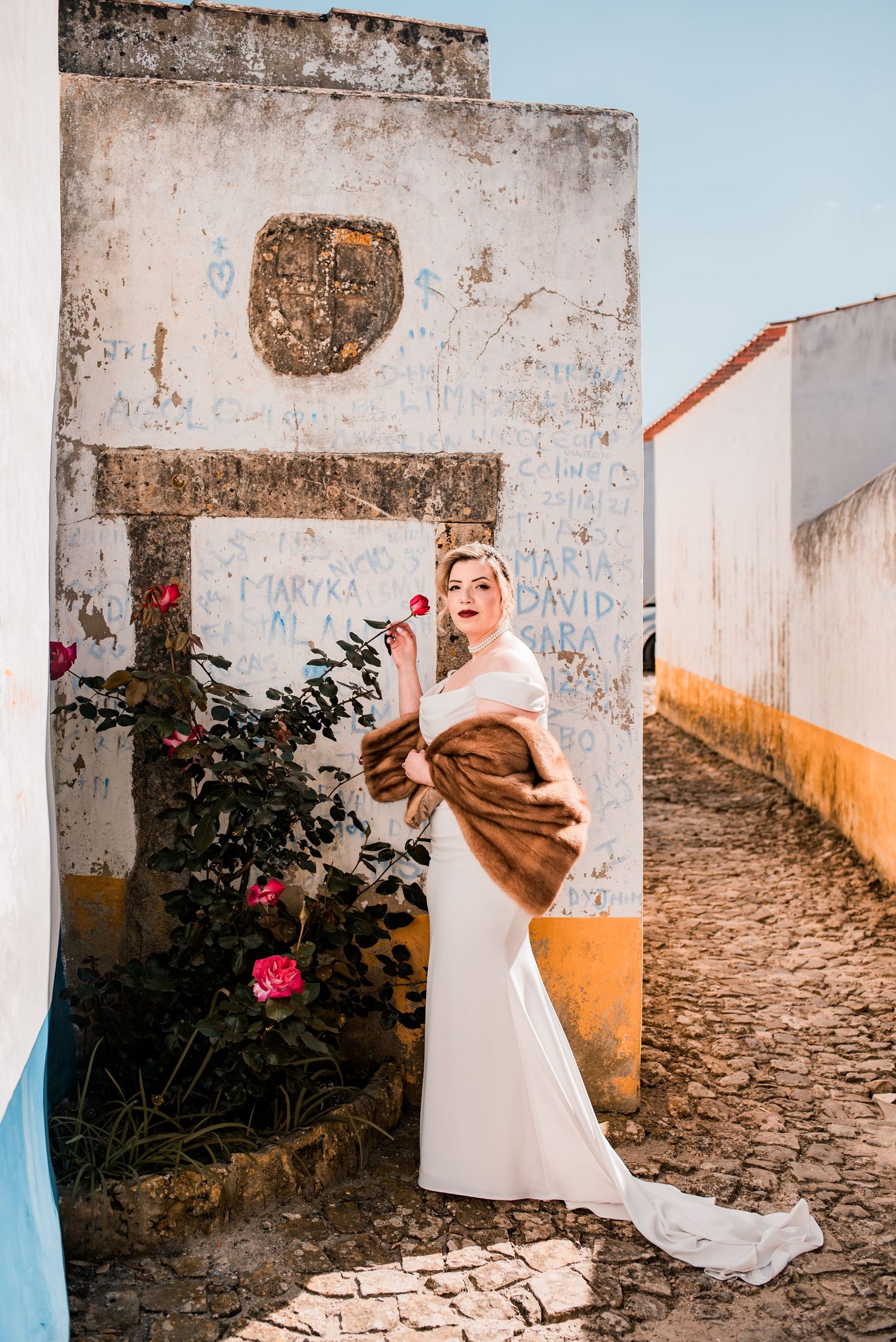 Destination wedding couple sharing a quiet moment in Óbidos, Portugal.