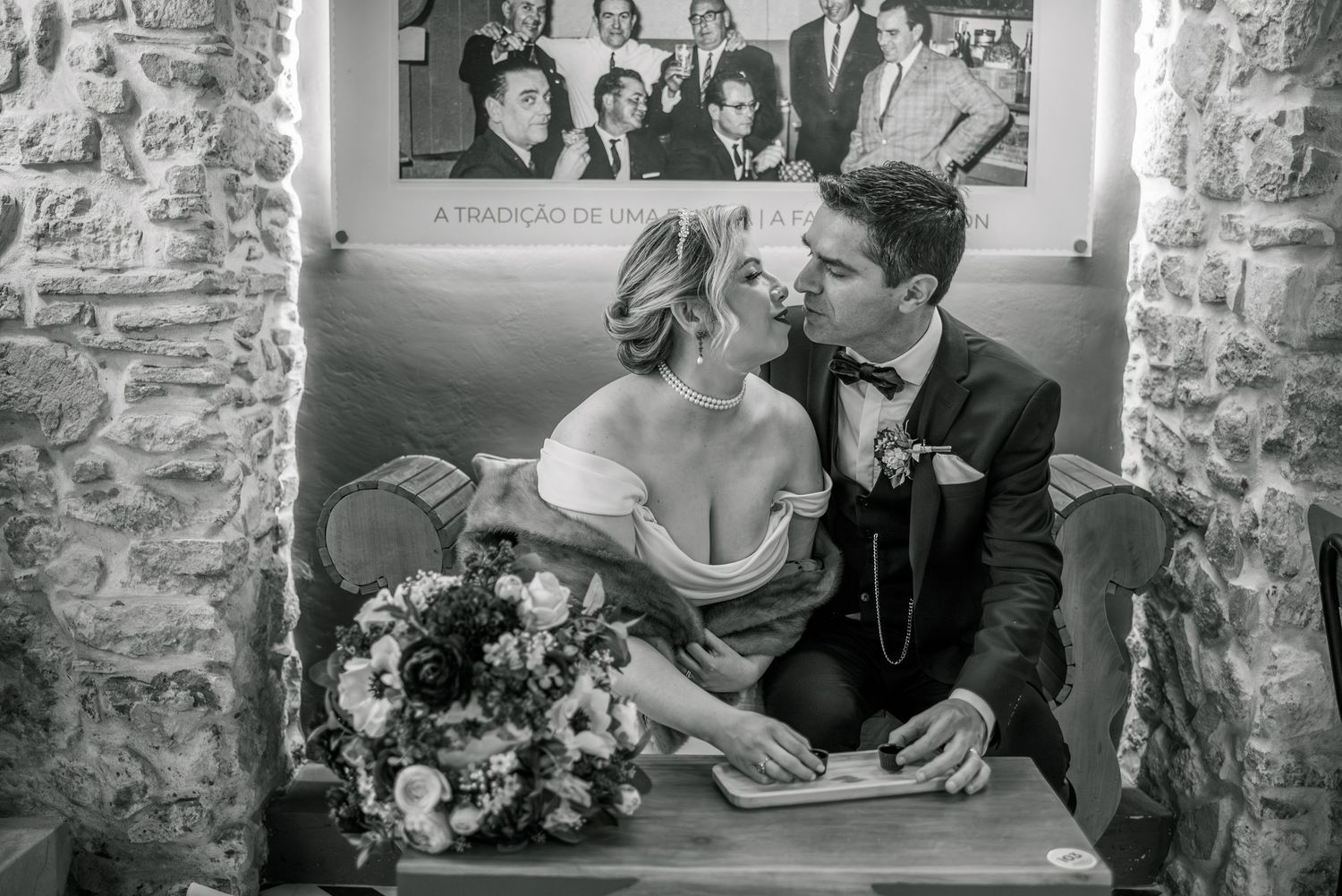 Destination wedding couple sharing a quiet moment in Óbidos, Portugal.