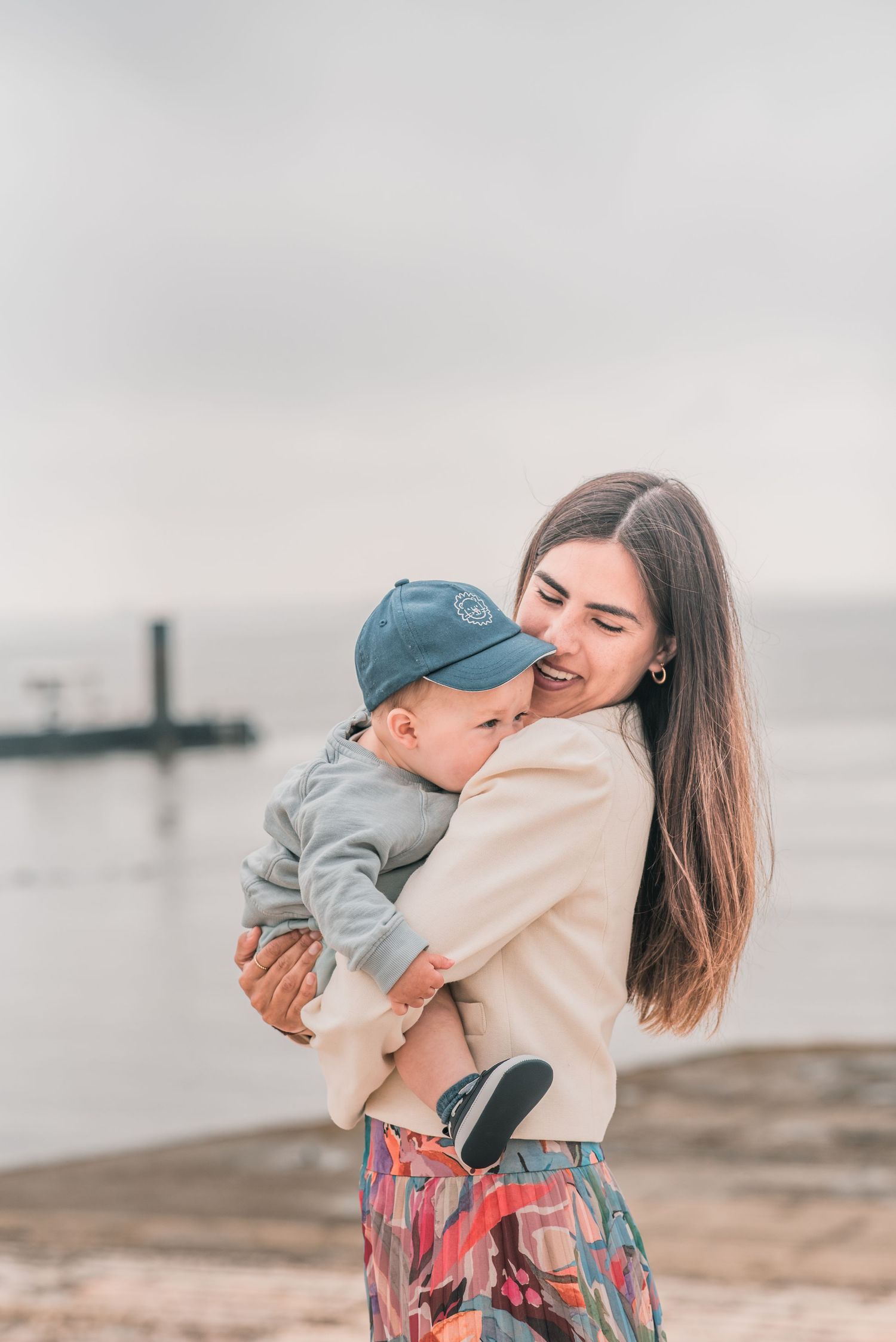 Parents and children sharing a joyful moment during a family session in Lisbon.