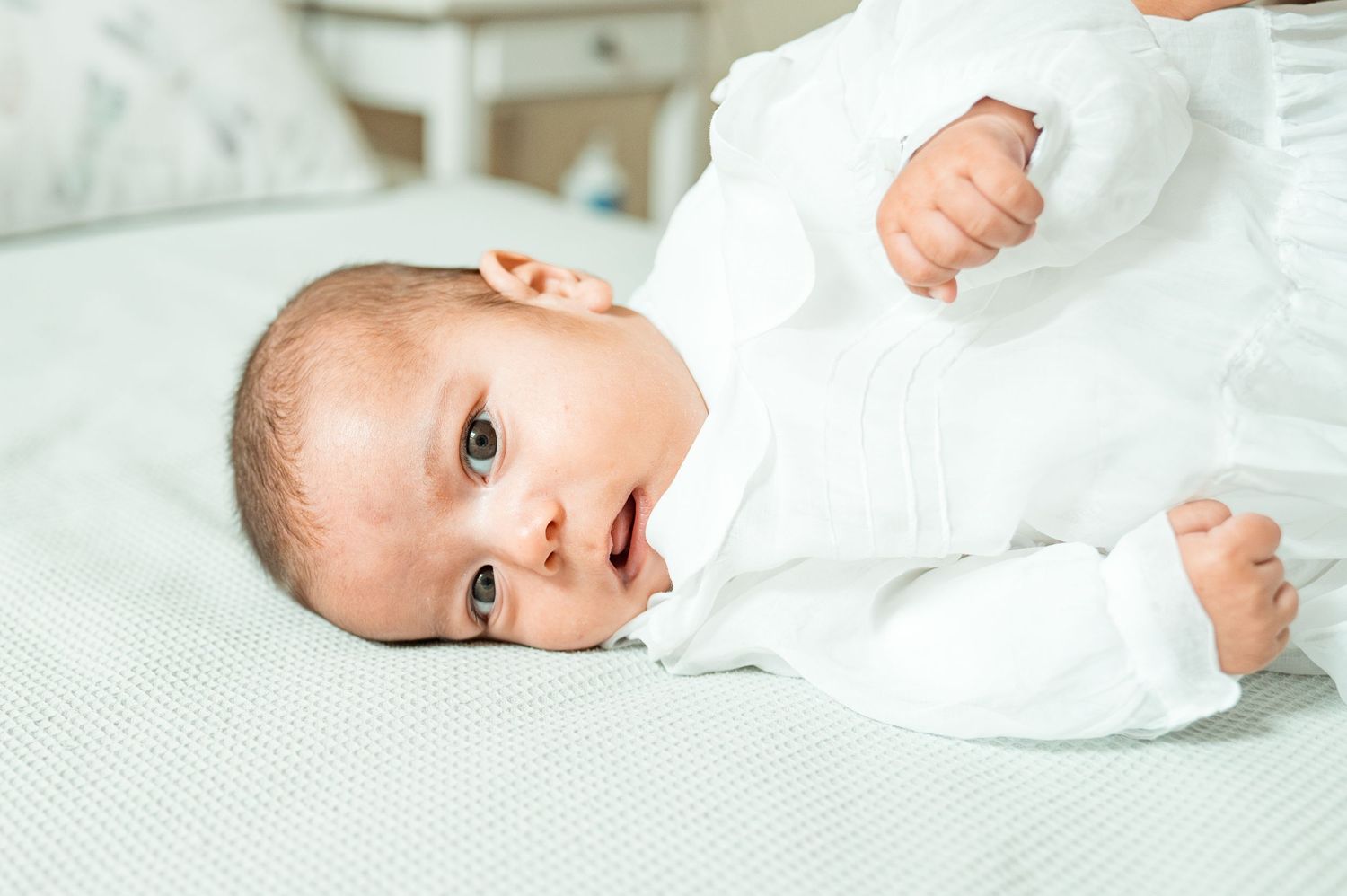 Baby baptism photography capturing natural and heartfelt family moments.